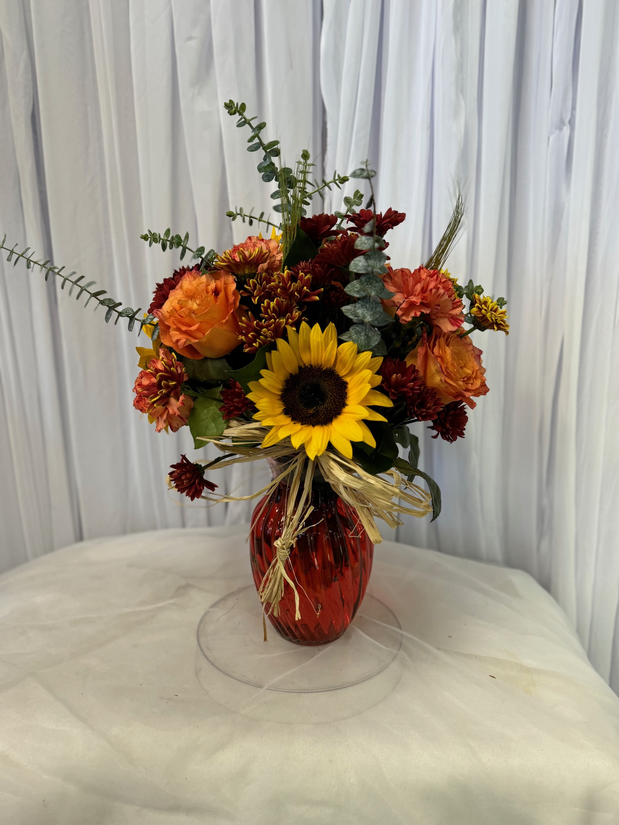 Autumn 10 - Disclaimer IF WE HAVE TO SUBSITUTE:  For flowers, we will make every attempt to match the flower type / color but may substitute with another color or type of flower. For green and blooming plants, similar plants may be substituted of equal or greater value. If the container / vase shown online is not available, a similar container / vase will be used. Bears or other gift items may be substituted as well. Want to check on availability? If it makes you feel more comfortable about the purchase, then we encourage you to call or email us to check on the latest availability of certain products. We would be glad to give you the most current, up-to-date status on our inventory. Deluxe - Additional flowers will be added to enhance the bouquet. Premium - We will add more blooms and select the highest quality flowers we offer in this style.