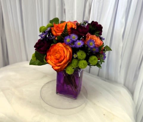 Autumn 7 - Disclaimer IF WE HAVE TO SUBSITUTE:  For flowers, we will make every attempt to match the flower type / color but may substitute with another color or type of flower. For green and blooming plants, similar plants may be substituted of equal or greater value. If the container / vase shown online is not available, a similar container / vase will be used. Bears or other gift items may be substituted as well. Want to check on availability? If it makes you feel more comfortable about the purchase, then we encourage you to call or email us to check on the latest availability of certain products. We would be glad to give you the most current, up-to-date status on our inventory. Deluxe - Additional flowers will be added to enhance the bouquet. Premium - We will add more blooms and select the highest quality flowers we offer in this style.