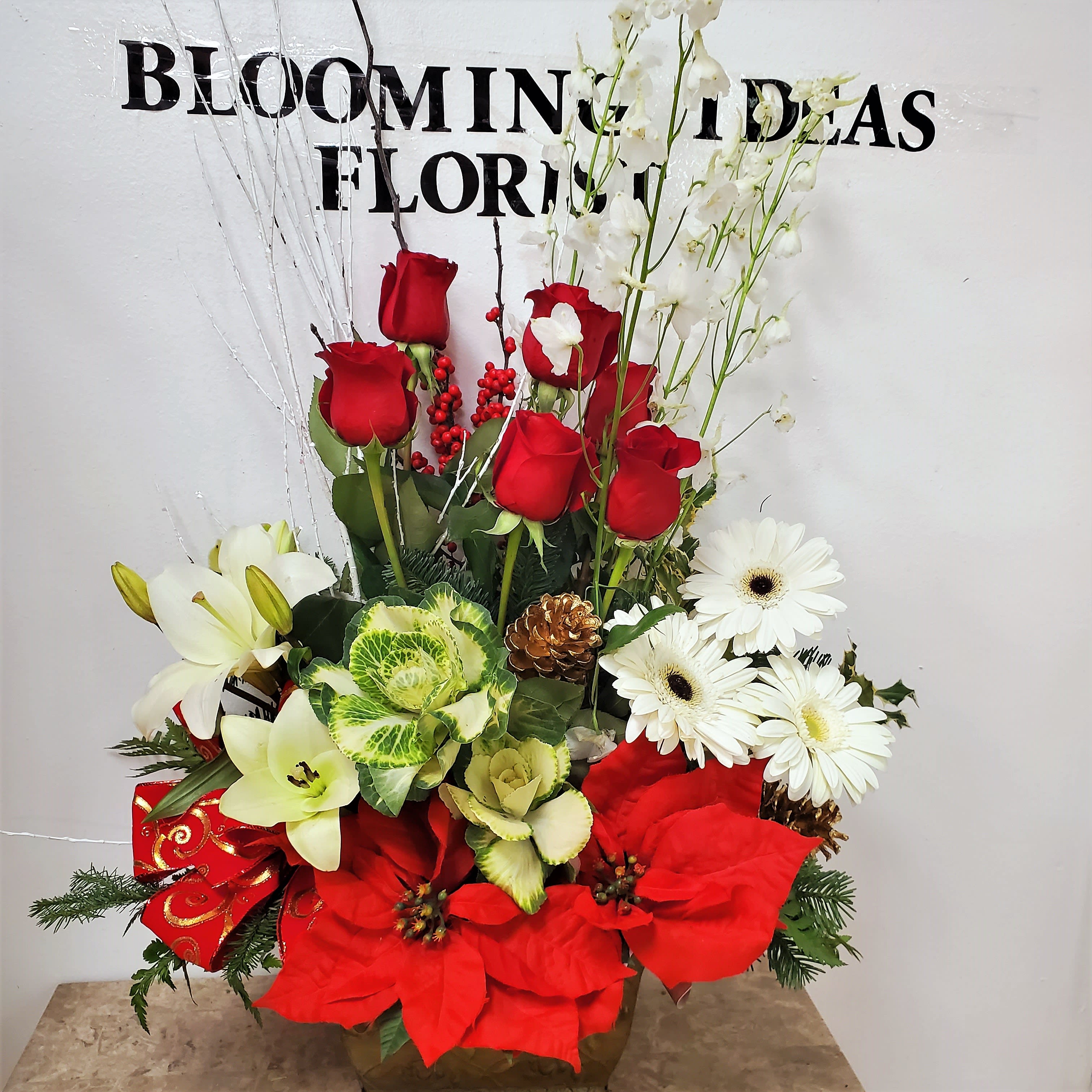 Christmas 2 - DISCLAIMER  IF WE HAVE TO SUBSITUTE:    For flowers, we will make every attempt to match the flower type / color but may substitute with another color or type of flower. For green and blooming plants, similar plants may be substituted of equal or greater value. If the container / vase shown online is not available, a similar container / vase will be used. Bears or other gift items may be substituted as well.  Want to check on availability?  If it makes you feel more comfortable about the purchase, then we encourage you to call or email us to check on the latest availability of certain products. We would be glad to give you the most current, up-to-date status on our inventory.  Deluxe - Additional flowers will be added to enhance the bouquet.  Premium - We will add more blooms and select the highest quality flowers we offer in this style.