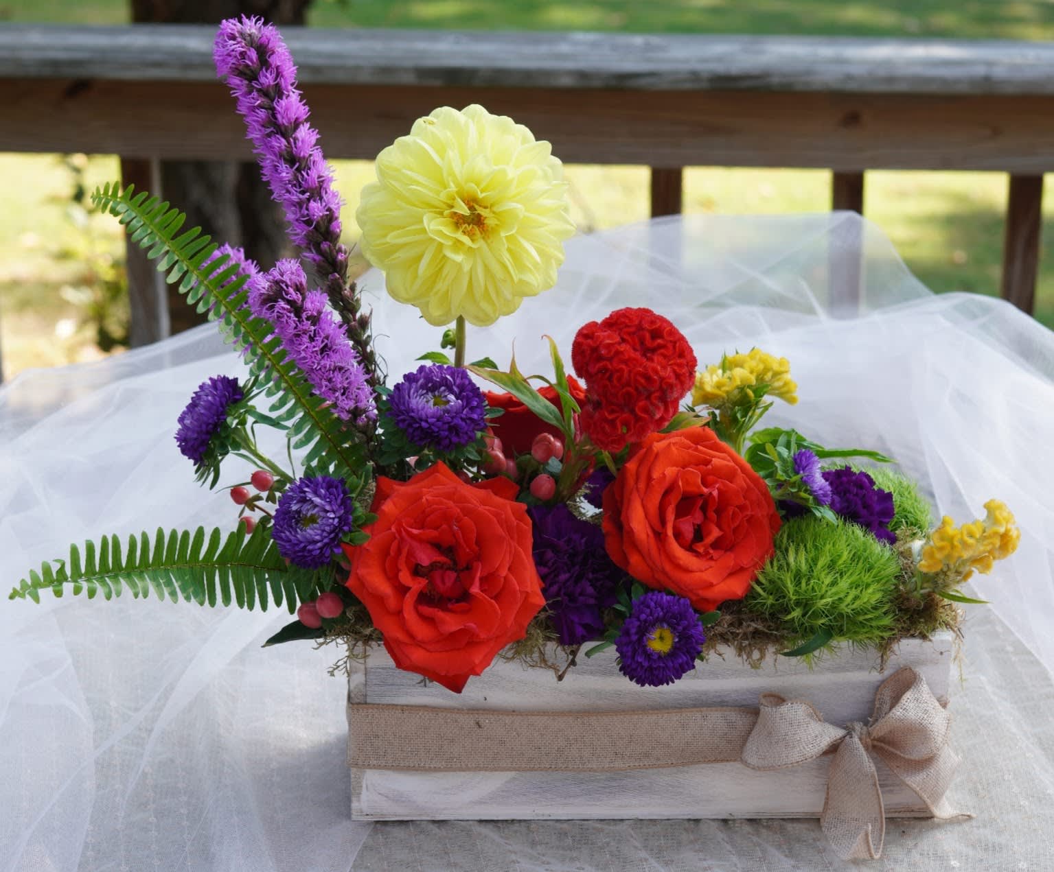 Fanciful Flower Box - Our charming, Fanciful Flower Box is a fun, bright and cheery mix of fresh, bold flowers that arrive in a farm-style wooden box surrounded by fresh moss. This modern, linear design is for someone who likes a little bit different and something interesting!  APPROXIMATE DIMENSIONS - 16&quot; in x 16&quot; in  