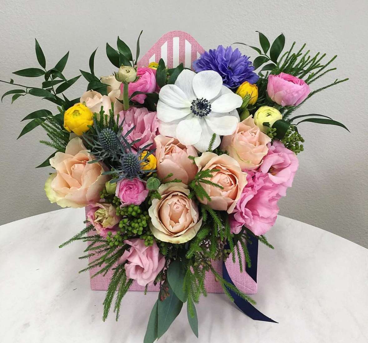 Envelope Flower Arrangement Envelope Flower Arrangement - Mixed flowers arranged in a envelope box