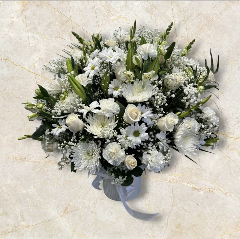 Morning Breeze - The combination of roses, daisies, lilies, spider and gladiolas make this arrangement look beautiful.