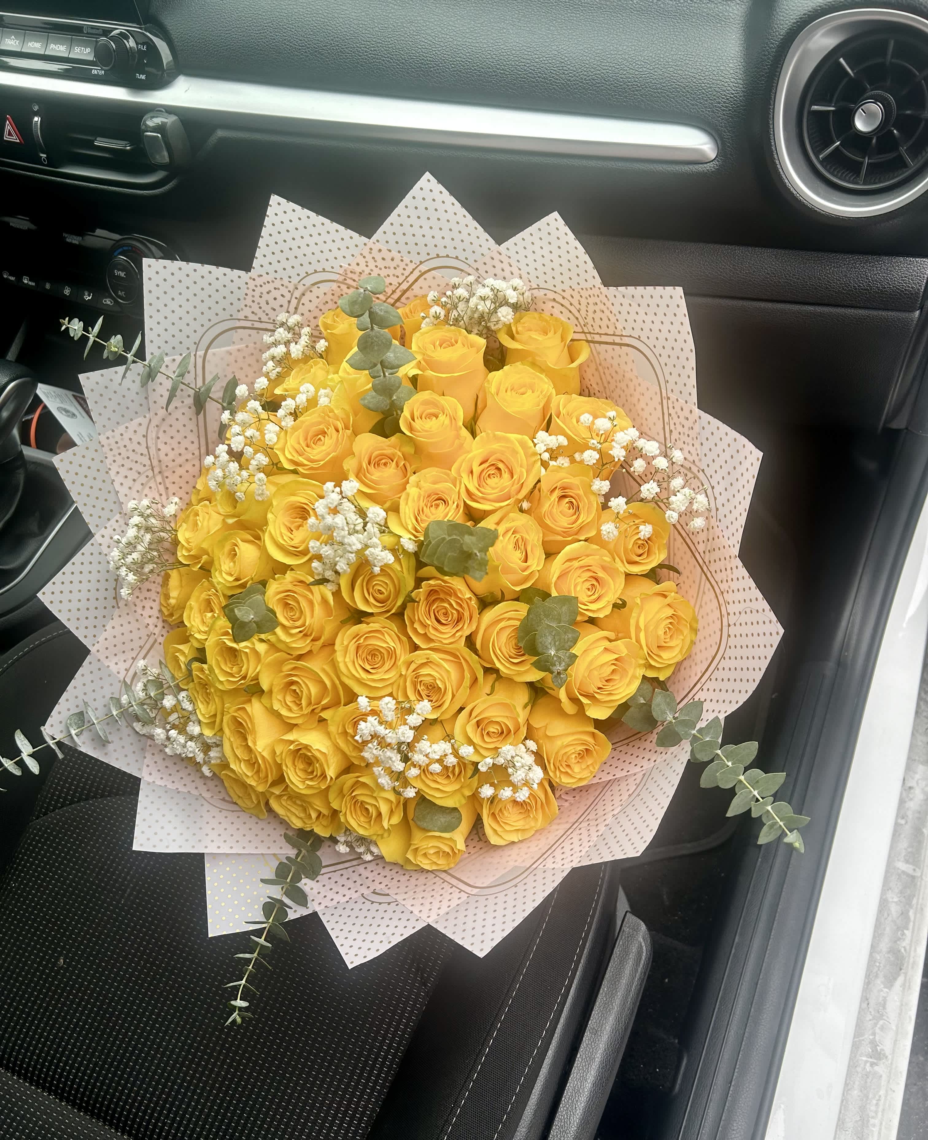 Delightful Smiles Bouquet - So Bright and Beautiful Yellow 50 Ecuadorian Rose Bouquet with the eaculyptus and baby breath details. Very unique and elegant gift for sure! Yellow lovers