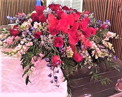 Sympathy Casket Spray - red roses, pink snaps, white daisys, pink and purple larkspur and baby breath