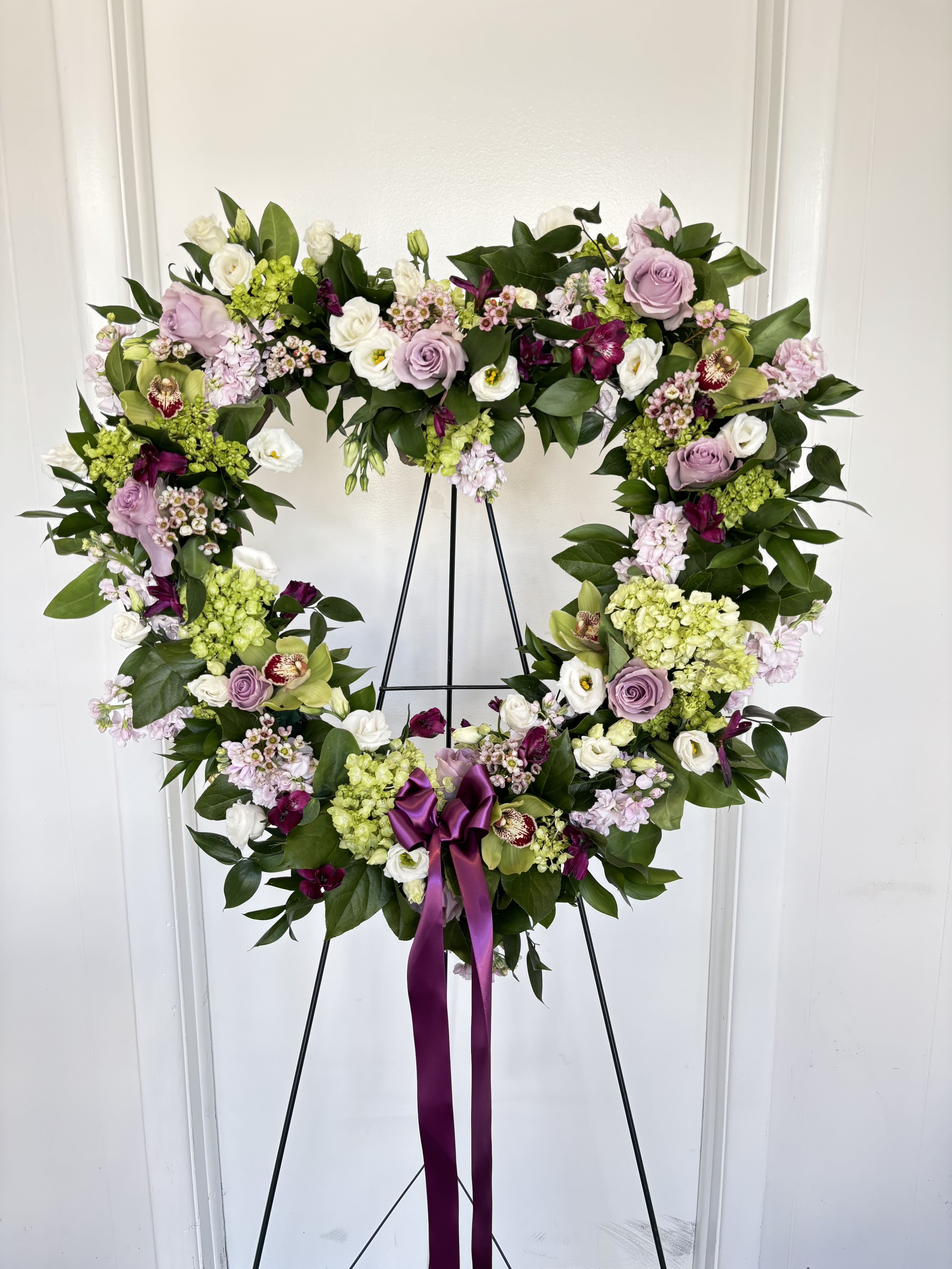 Large Heart multi color and flower - Green hydrangea, white lisianthus, green cymbidium orchids, light purple roses, light purple stock and premium greens 