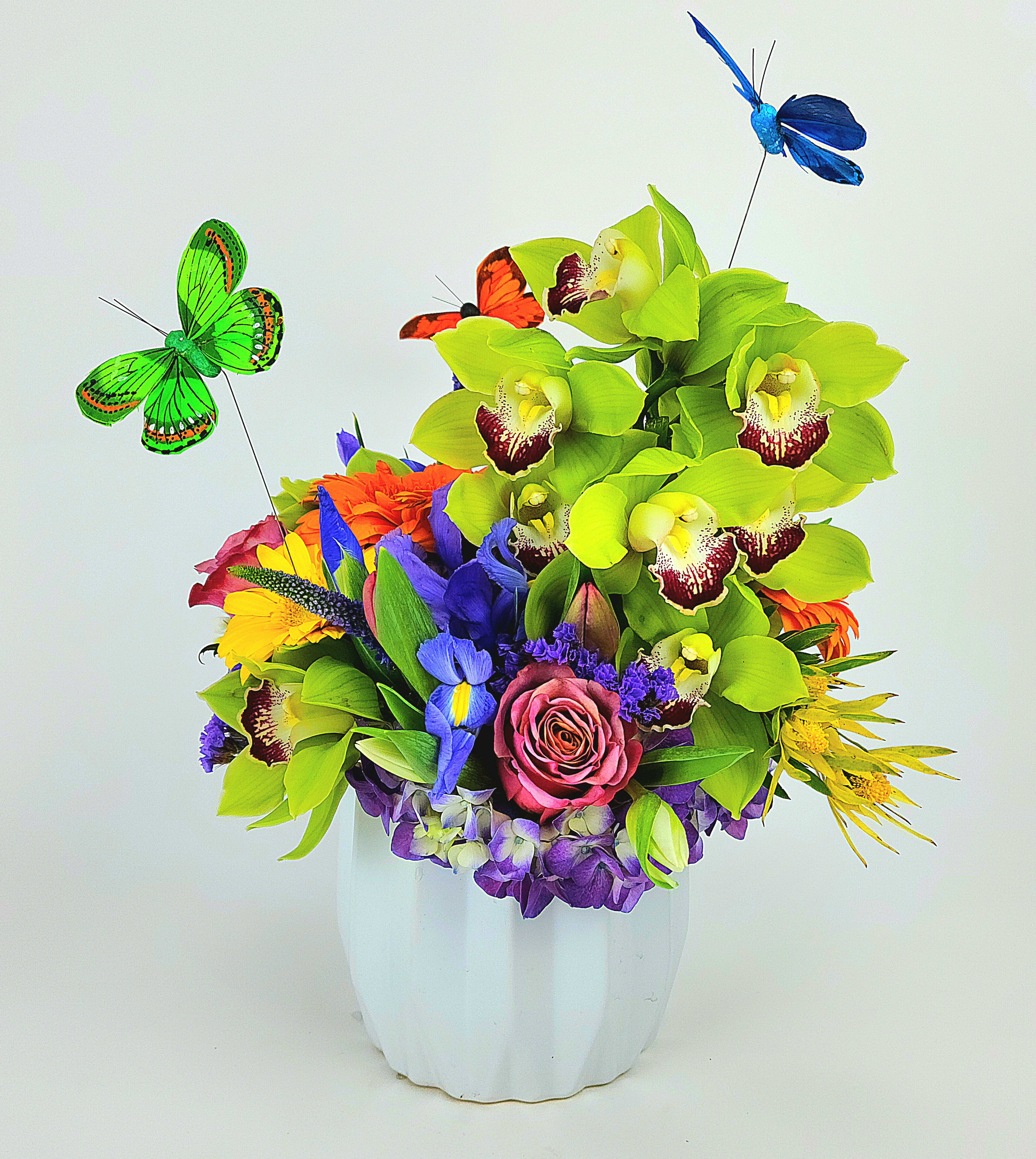 Macondo - Beautiful spring colors arrangement with orchids, hydrangea, roses, and mix flowers