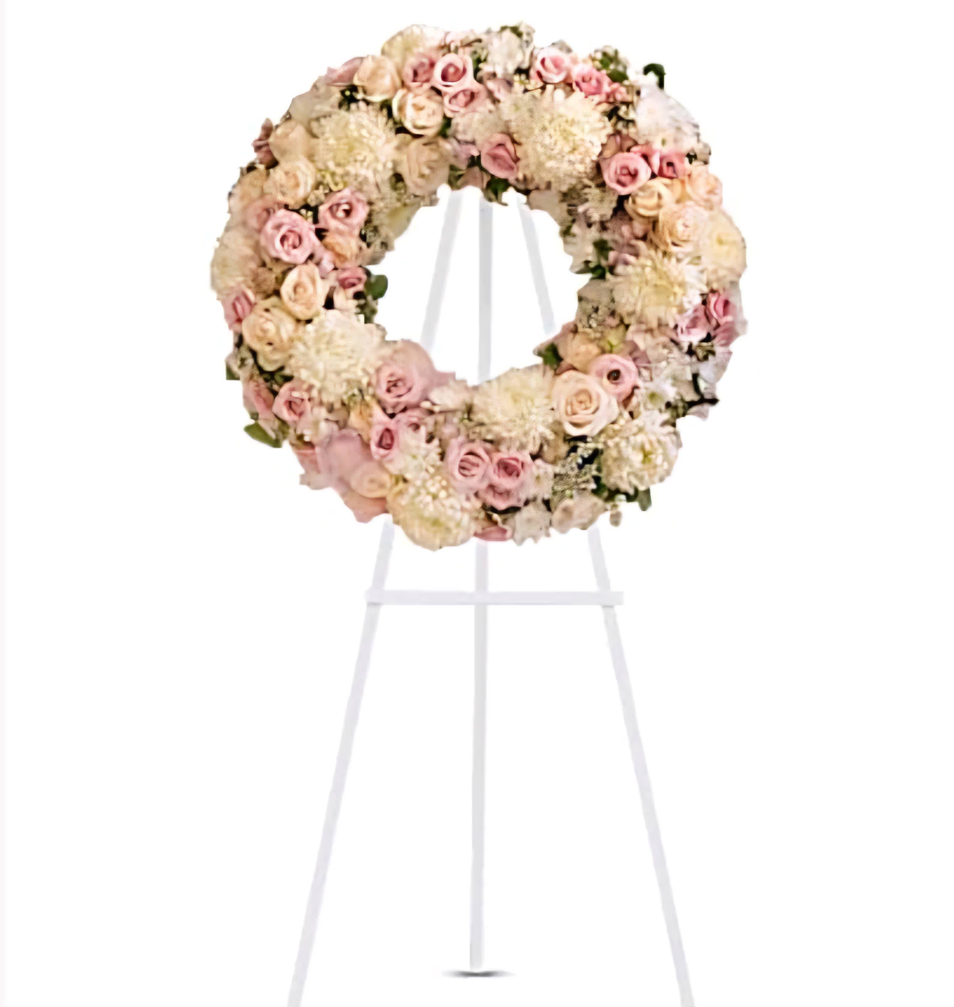 Pink and white funeral standing spray - Honor a loved one with our Pink and White Funeral Standing Spray, a graceful tribute featuring soft pink and white blooms, beautifully arranged to convey sympathy and respect.
