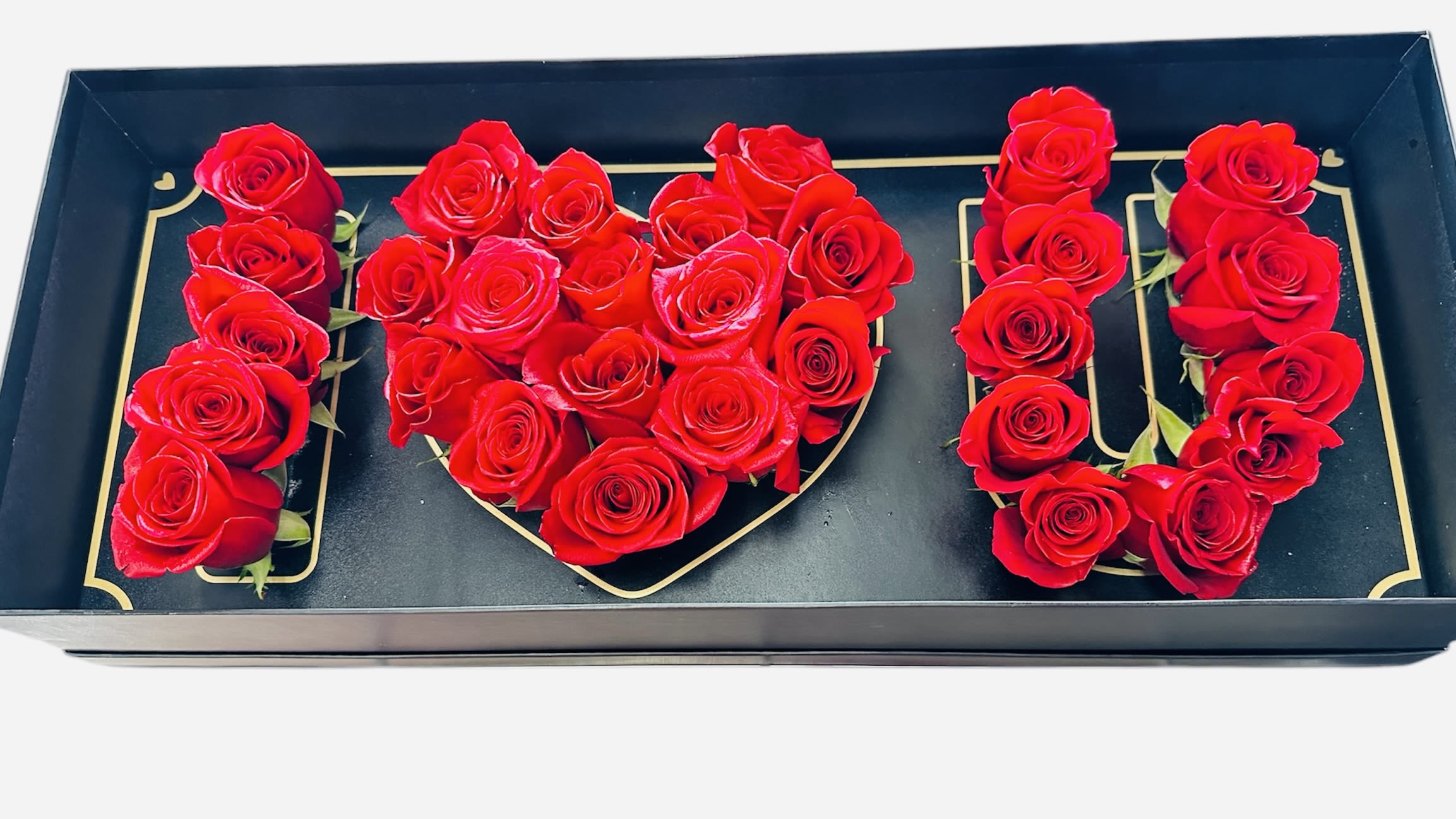 I LOVE YOU ️  - A beautifully arranged floral design using fresh red roses, forming the letters “I ️ U” in a black gift box. The vibrant red roses symbolize love and passion, making it a perfect romantic gift. The elegant presentation enhances its appeal, making it ideal for special occasions like anniversaries or Valentine’s Day.