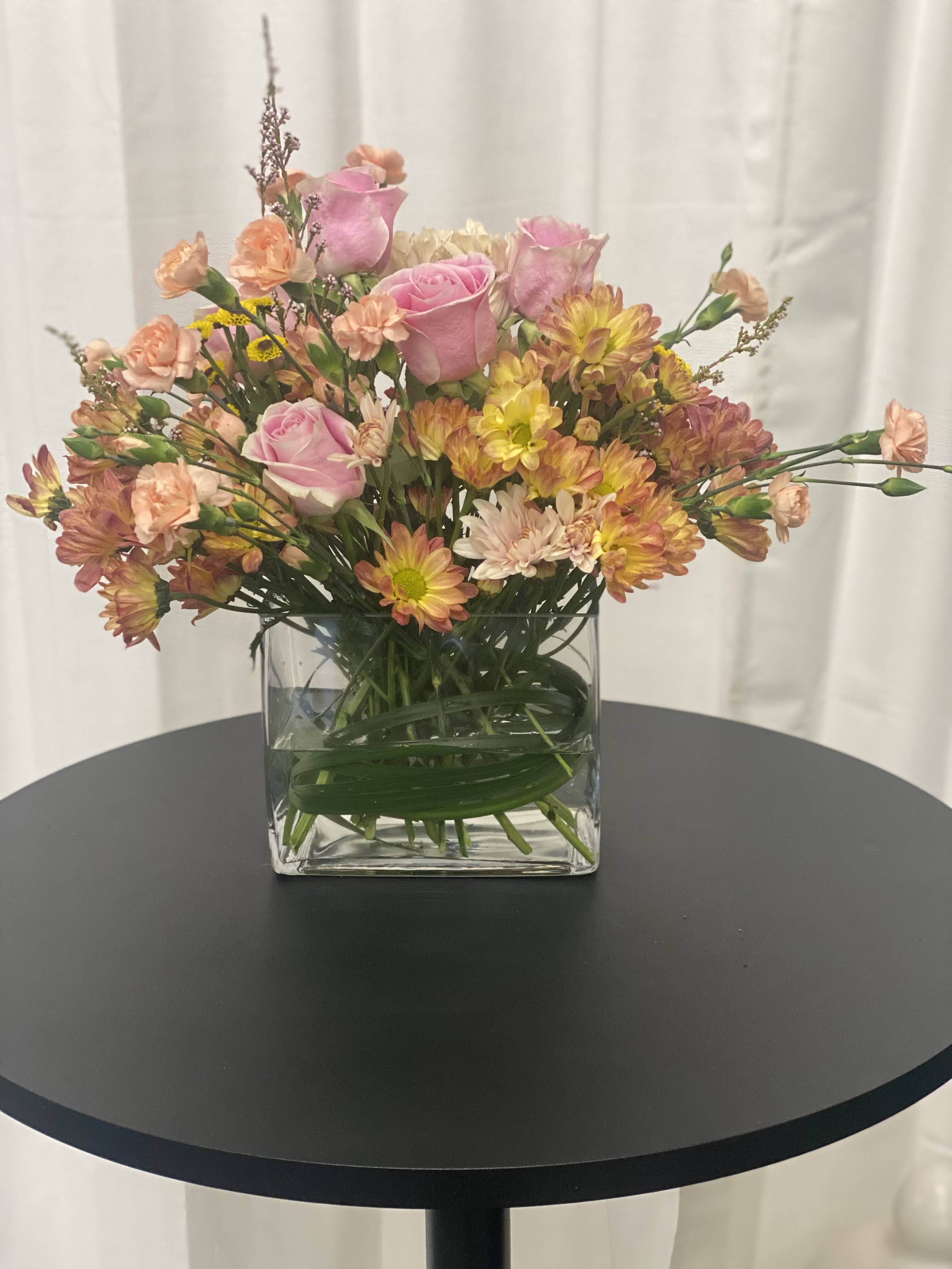 Is'nt she lovely Is'nt she lovely - Spring blooms arranged in an oblong vase