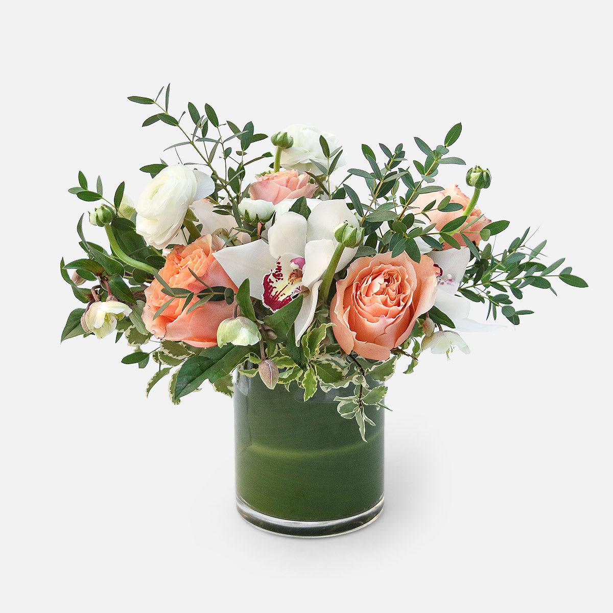 Holding Hands - [ Height: 12&quot; - 13&quot; | Diameter: 10&quot; - 11&quot; ]  Perfect for any celebration, the Holding Hands floral arrangement is bright, cheery, and tasteful. Peach roses stand out alongside the cool, neutral tones of the white ranunculus, hellebore, and cymbidium orchids. Fragrant eucalyptus and other greens provide soft texture and fullness to this pleasant display.