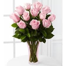 Blushing Beauty Rose Bouquet Blushing Beauty Rose Bouquet - Picture-perfect soft pink roses make a beautiful gift for the lovely lady in your life. Wife, mother, daughter or sweetheart, she's sure to cherish this bouquet of pastel pink roses accented with seeded eucalyptus and arranged in a clear glass vase.