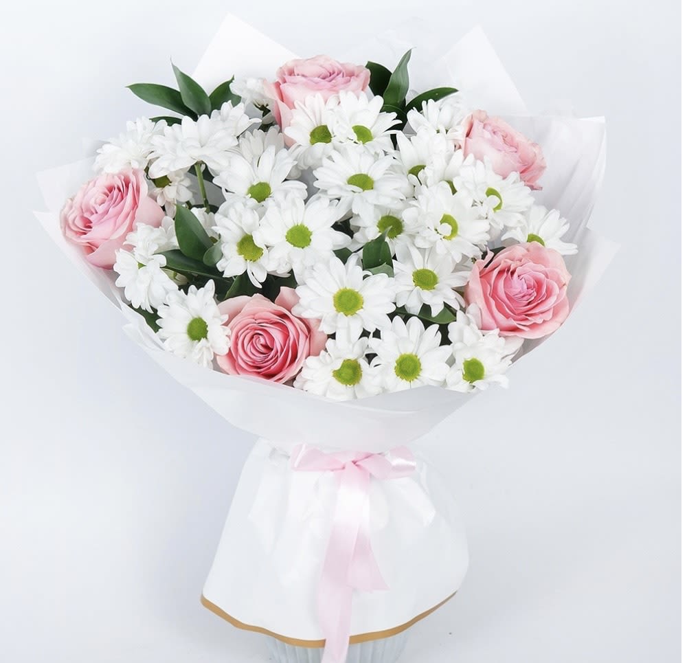 Graceful Daisy &amp; Rose Bouquet  - This charming white daisy and pink rose bouquet is a perfect blend of freshness, elegance, and timeless beauty. Wrapped in delicate white paper with a satin ribbon, this bouquet radiates grace, warmth, and sophistication, making it an ideal choice for celebrations, heartfelt gifts, and special occasions.   Fresh white daisies and soft pink roses for a delicate, romantic touch  Perfect for birthdays, anniversaries, Mother's Day, and thank-you gifts  A beautiful floral arrangement for home décor, offices, and special events  A timeless bouquet symbolizing love, purity, and appreciation  Same-day flower delivery in Los Angeles   Brighten someone’s day with this elegant daisy and rose bouquet. Order today and let your emotions bloom beautifully!