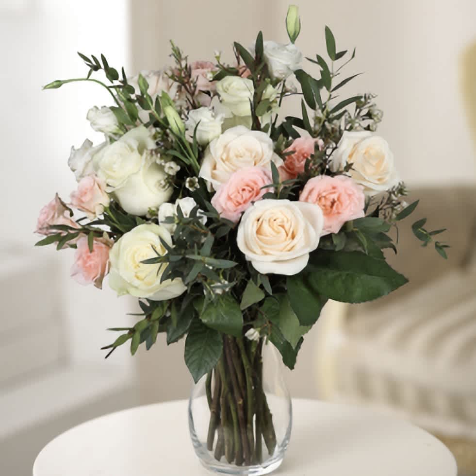 Flowers &quot;Just For You&quot; - Experience the exquisite charm of this bouquet, featuring a harmonious blend of roses and lisianthus in delicate shades of peach and white. The soft, romantic hues of the roses symbolize love and appreciation, while the elegant lisianthus adds a touch of sophistication and grace. Together, these flowers create a stunning arrangement that radiates warmth and tranquility. Perfect for any special occasion or to brighten someone's day, this bouquet embodies a perfect balance of beauty and elegance, making it a heartfelt gift that speaks volumes.