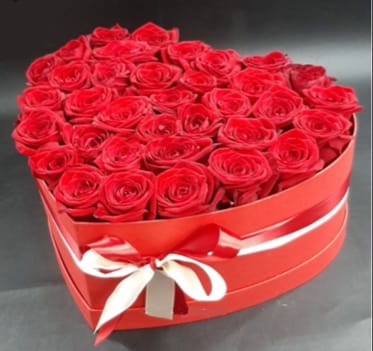Heart of Red Roses  - This stunning arrangement of velvety red roses is the ultimate symbol of love, romance, and passion. Carefully handcrafted in Los Angeles, these fresh, vibrant roses are beautifully presented in a luxurious heart-shaped red box, adorned with an elegant satin ribbon. Perfect for Valentine's Day, anniversaries, proposals, or as a heartfelt gesture, this arrangement speaks the language of love like no other.  Ideal for Los Angeles residents seeking premium floral arrangements, this gift is perfect for special moments. Whether you're looking to surprise someone or make a grand romantic gesture, this timeless red rose box is designed to leave an unforgettable impression.