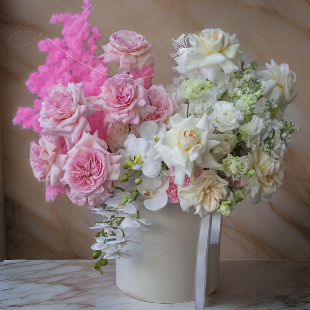 Los Angeles Elegance - Introducing Los Angeles Elegance: A Bouquet That Speaks Luxury, a sophisticated floral arrangement featuring exquisite roses, delicate lisianthus, vibrant carnations, and elegant orchids. This luxurious bouquet brings together a blend of classic beauty and modern charm, perfect for any special occasion. The rich hues of roses symbolize love and admiration, while the soft petals of lisianthus and carnations add depth and texture. The striking orchids complete this stunning arrangement, making it a true statement piece. Ideal for gifting or as a centerpiece, this bouquet exudes elegance and grace. Available for flower delivery in Los Angeles, this luxury floral arrangement is the perfect way to make an unforgettable impression.