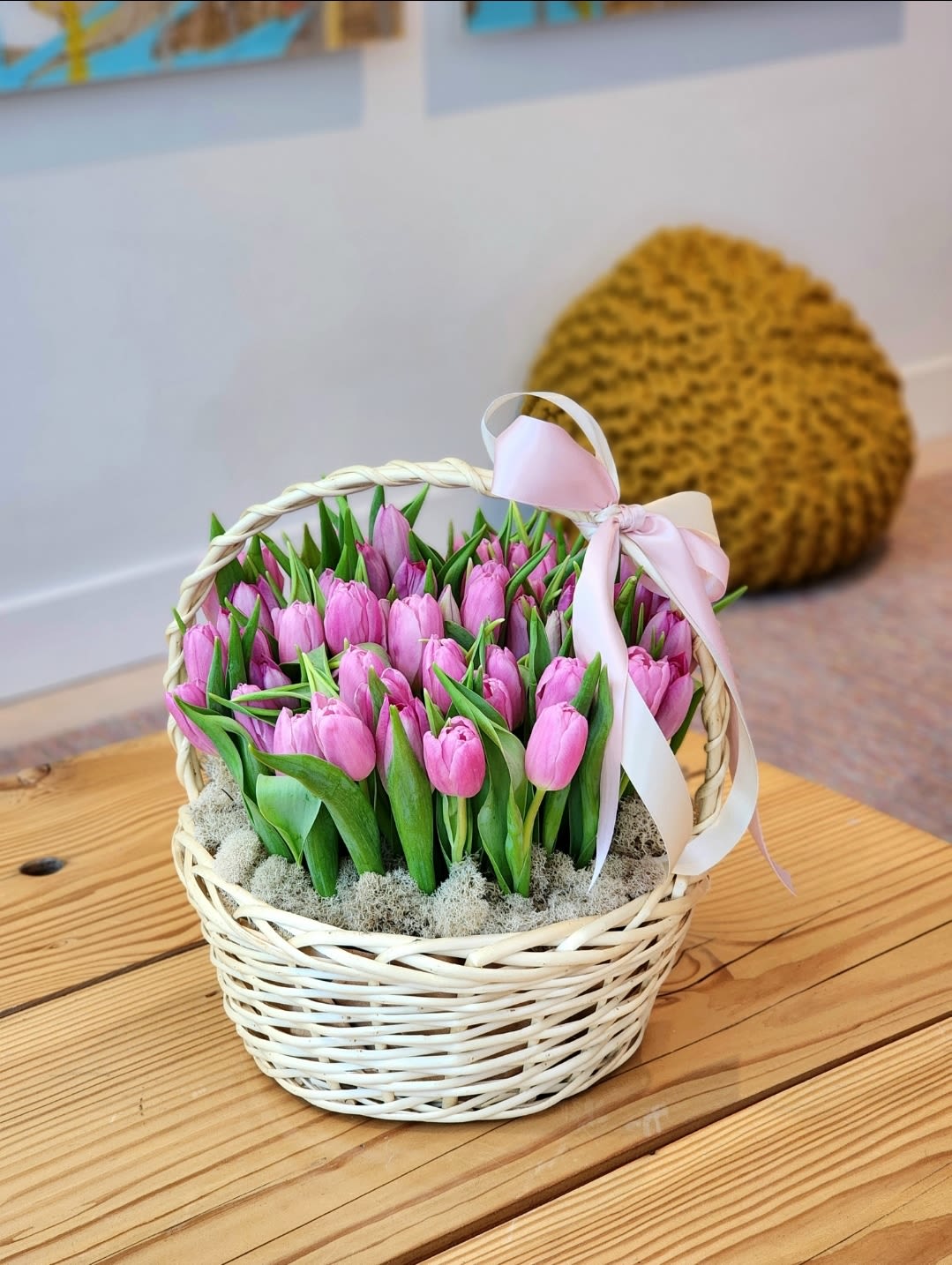  A Rustic Charm  - Brighten any space with this vibrant tulip basket featuring a pink of tulips. The basket adds a rustic charm, making it ideal for birthdays, or simply bringing joy to your loved ones. Fresh and colorful, this arrangement is perfect as a cheerful home accent or a thoughtful gift. Order now for same-day delivery and share the beauty of fresh tulips today!