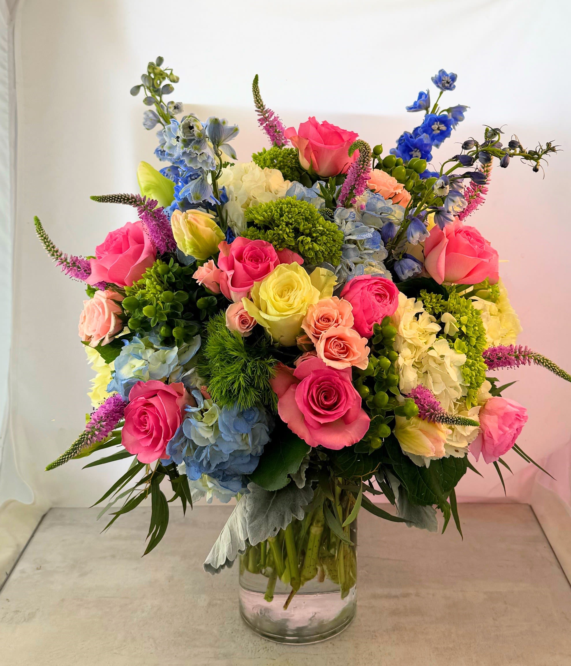 French Countryside - A bouquet made in the grand style! Reminiscent of floral bouqets seen in some of the great impressionist, painters such as Claude Monte. This bouquet is sure to be cherished and fill your loved one with fond thoughts of you! 