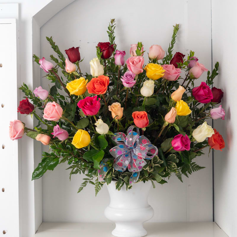 Rainbow Rose Arrangement Rainbow Rose Arrangement - 3dz. colorful front facing rose arrangement (roses can be any color upon request) If some flowers and/or the vase are not available there will be minor substitutions