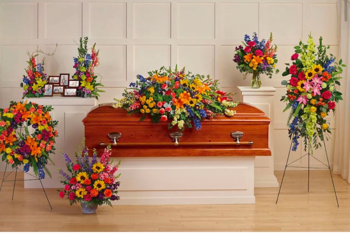  Colorful tribute  - This package reflects the beautiful color of your beloved memories, with this colorful Tribute collection, hand crafted onsite serenity wreath, , Casket spray, Hues of Hope bouquet and more 