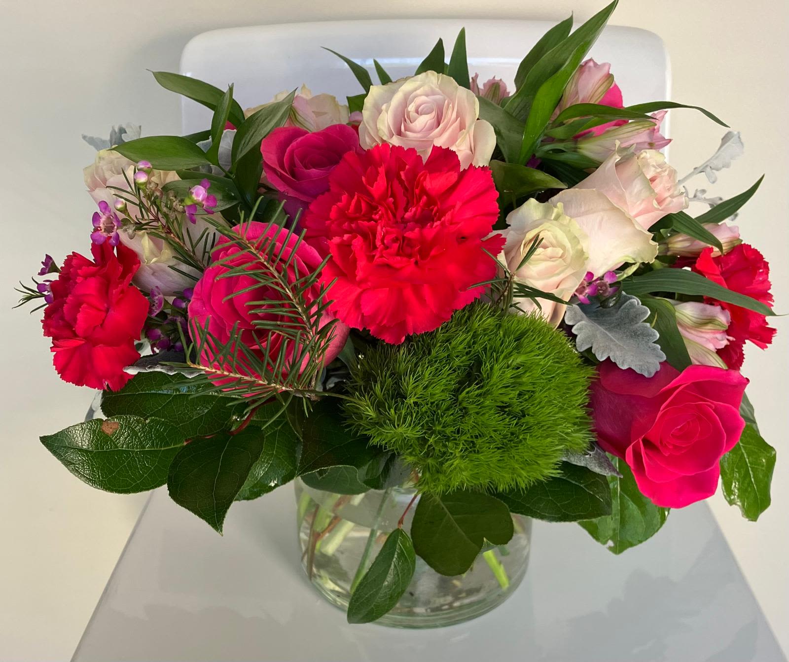 Patricia Bouquet - All Occasion Clear Vase Place your Order Online Monday to Saturday before 1:00 p.m. (E.T.) for same-day delivery. “Orders received after hours will be delivered the next business day”. Check our coverage area. Occasionally, substitutions of flowers and/or containers happen due to weather, seasonality, and market conditions which may affect availability. If this is the case with the gift you’ve selected, we will ensure that the style, theme, and color scheme of your arrangement are preserved and will only substitute items of equal value or higher value.  CARE INSTRUCTIONS Keep the flower arrangement hydrated with natural water and change the water every two days. Do not spray any cleaning product on the flower arrangement. Do not place heavy objects directly on the flower arrangement. Keep flower arrangements out of direct sunlight and extreme heat.