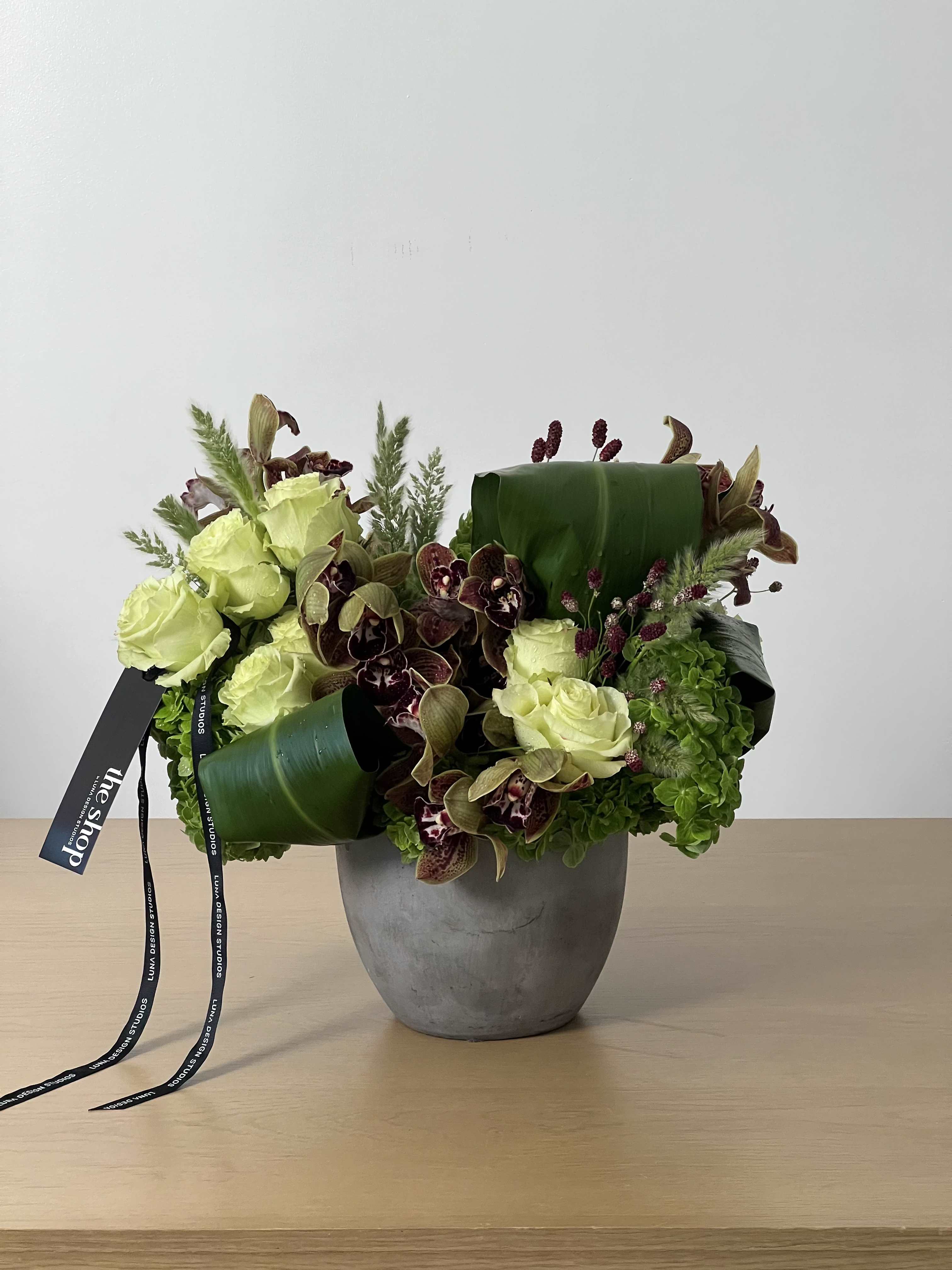 LOTUS - - Combines natural elements with rich, luxurious flowers for a balanced aesthetic. - A modern floral arrangement with a sleek and stylish composition - Minimalist yet bold, making it an excellent addition to any space * PICTURED AS $250.00 *