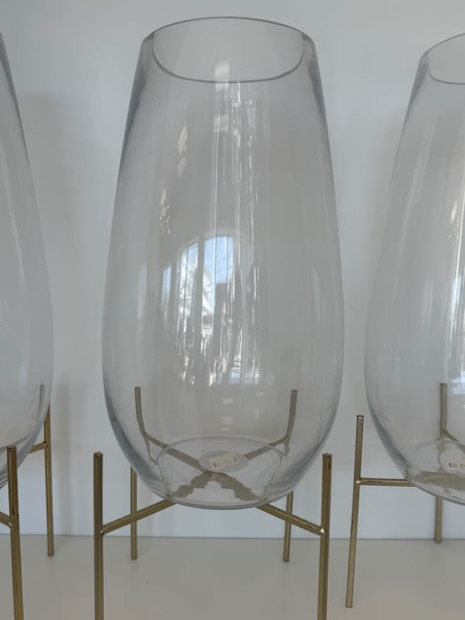 Vintage Charm Iron & Glass Vase Vintage Charm Iron & Glass Vase - A unique iron-framed glass vase with a retro-inspired aesthetic, perfect for floral arrangements.