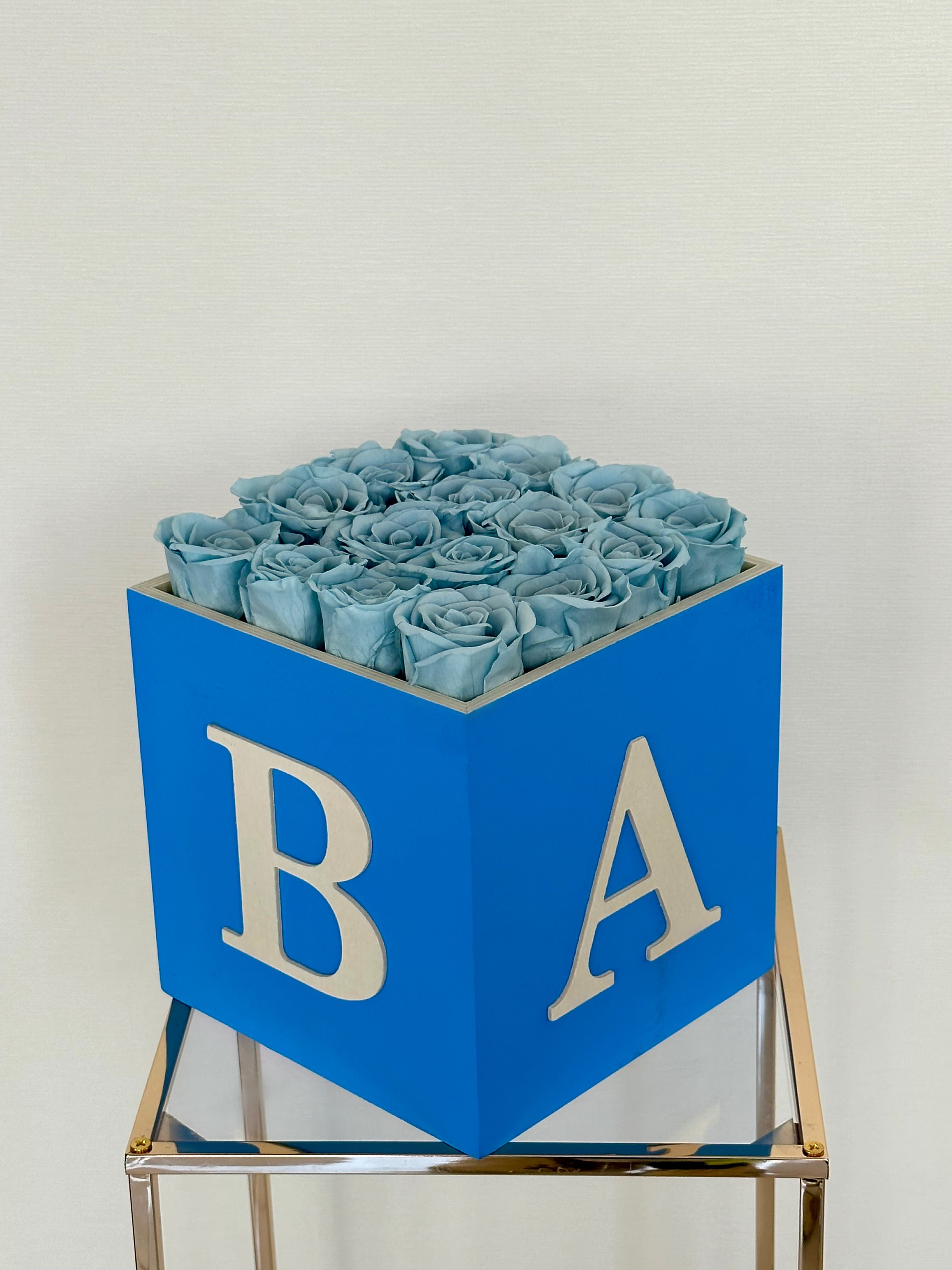 Baby Boy Box - Preserved Roses - Introducing a timeless gesture of love and celebration for the arrival of a precious newborn: the Blue Box of Forever Roses. Encased in an elegant, sky-blue box, these everlasting roses symbolize the enduring bond between parent and child, a love that blossoms eternally. These roses last for years and serve as a charming addition to any nursery decor, infusing the space with warmth and love. PRESERVED ROSES. NOTE: The shade and size of blue roses may vary slightly from the image, depending on availability.