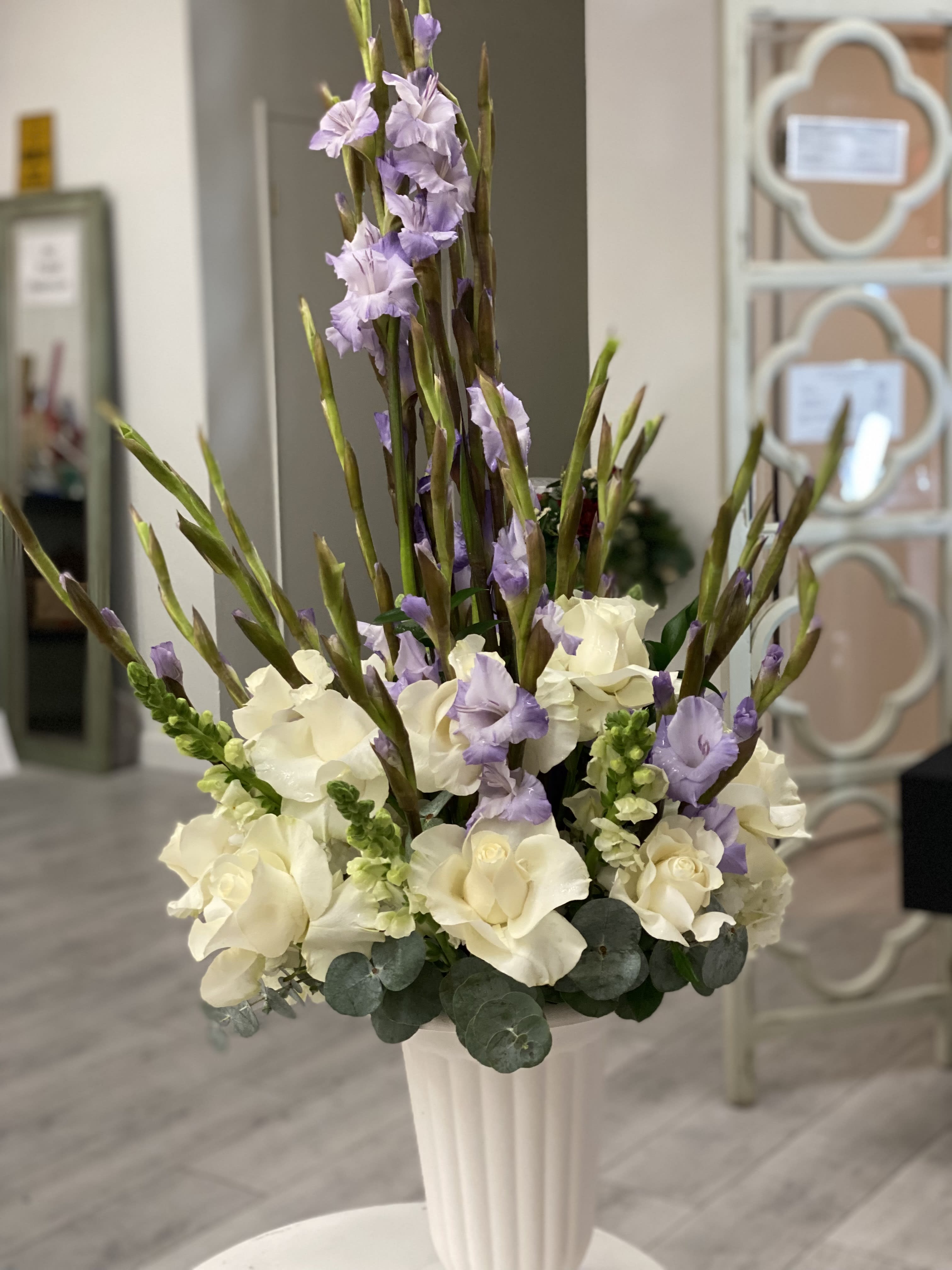 Purple and White Centerpiece - Purple and White Roses, Gladiolus, snapdragon, eucalyptus makes this one the perfect one to send