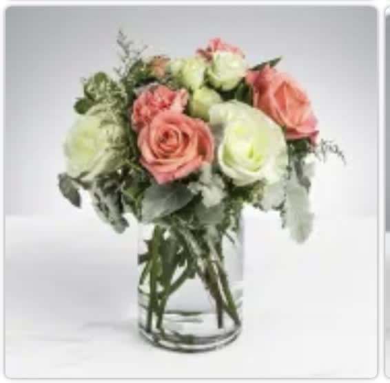Sweet &amp; Subtle by BloomNation™ - This arrangement includes pink roses, white roses, white spray roses, pink carnations, and dusty miller. Sweet &amp; Subtle by BloomNation™ is the perfect gift for a birthday, thank you, or just because.   APPROXIMATE DIMENSIONS: 9&quot; H X 10&quot; W
