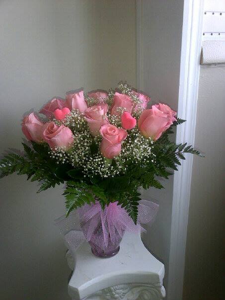 Dozen Roses - 12 Roses of your color choice, depending on availability, with filler in a vase with beautiful ribbon or tulle. (includes one color of rose, only. Specific color requires 48 hours notice, please)