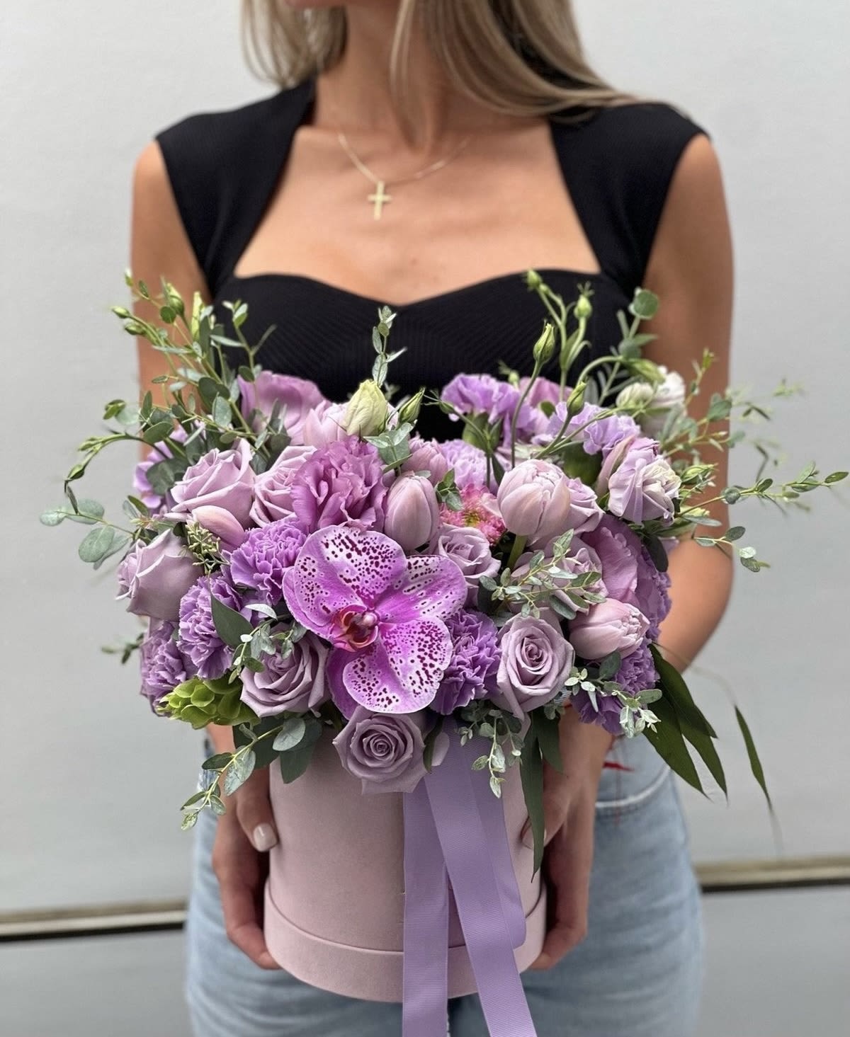 Elegant Purple Floral Box  -  Royal Bloom – Elegant Purple Floral Box   Elevate your gifting with the Royal Bloom Floral Box, a luxurious arrangement of delicate lavender roses, tulips, lisianthus, and a stunning orchid centerpiece. Presented in a stylish round box with a soft satin ribbon, this exquisite bouquet is perfect for expressing love, appreciation, or celebration.   Why Choose This Arrangement?  Premium Fresh Blooms – Long-lasting beauty and fragrance  Sophisticated &amp; Chic Design – A timeless floral statement  Perfect for Every Occasion – Birthdays, anniversaries, romantic gestures, or luxury home décor  Fast &amp; Secure Delivery – Order online and have it delivered hassle-free   Shop now &amp; make every moment special with floral elegance!