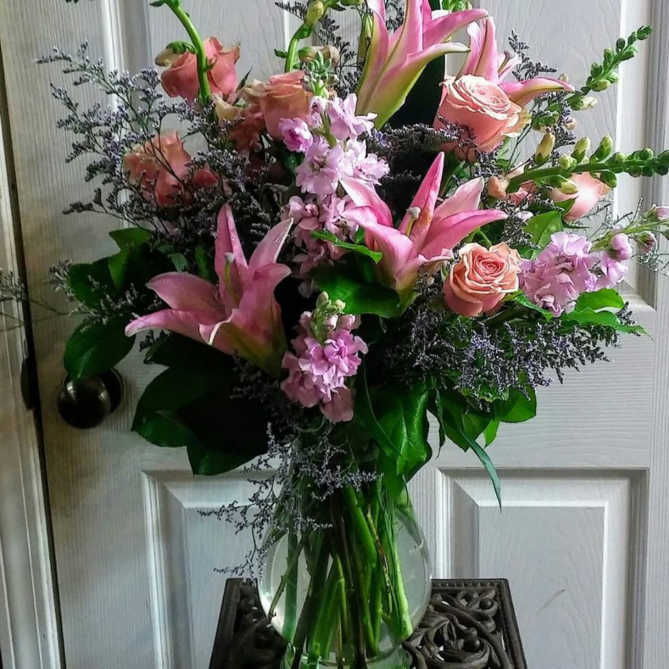 Forever Love - This arrangement is filled with 1/2 dozen of our beautiul premium roses, lilies, stock, snampdragons and more. Makes a perfect gift for any occasion!