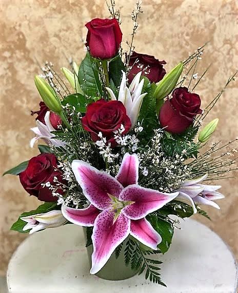 Gazing Roses - What a statement these 1/2 dozen Red Roses make with the addition of Star Gazier Lilies and filler. 