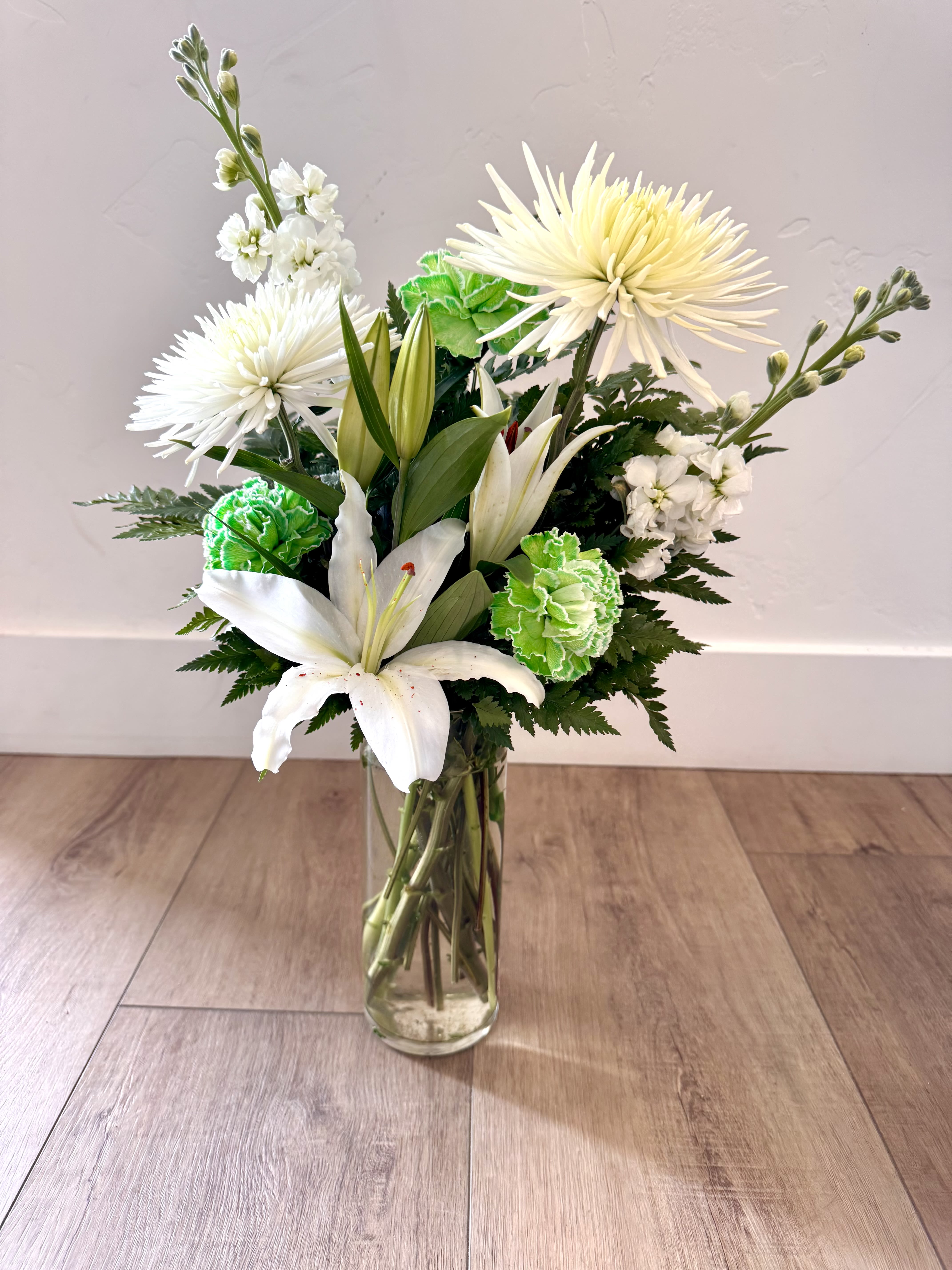 March in Bloom March in Bloom - Featuring White Poms, Green Carnation, White Lilies and Fill