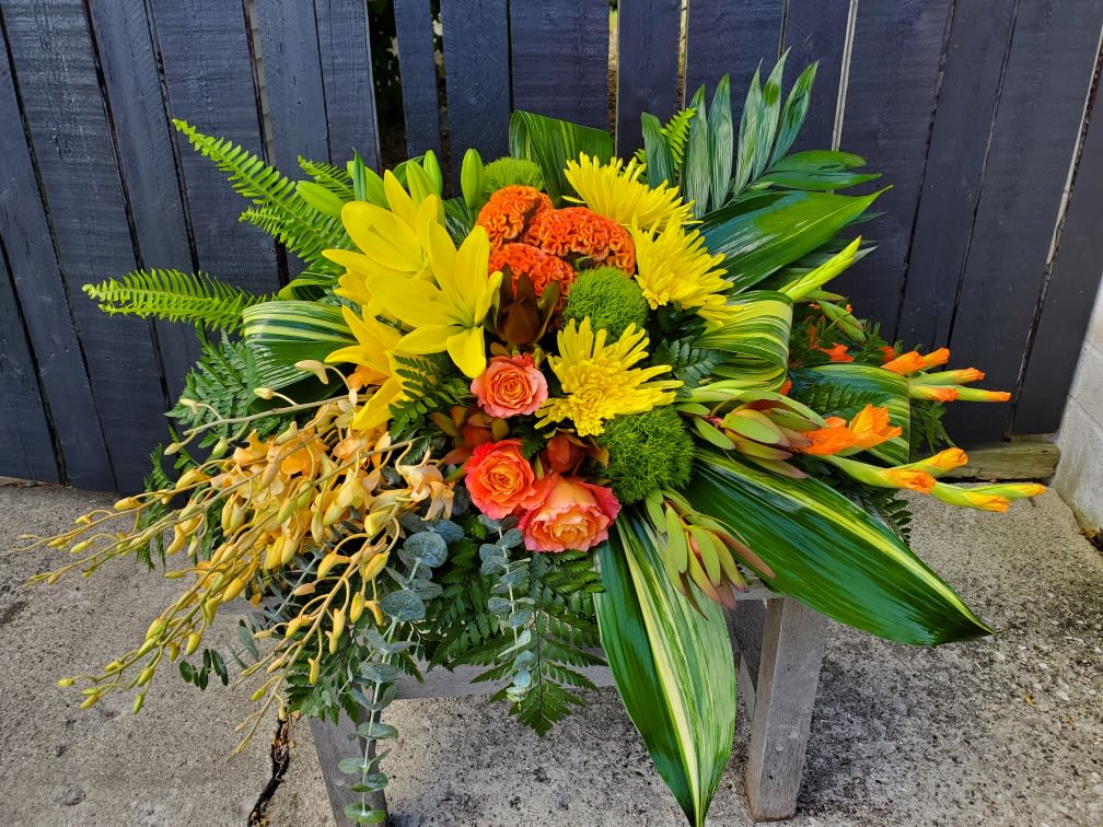 Alya - Graceful and fresh, this tropical-influenced spray sheds light on memories that will be forever treasured. Splashed with color and grounded with earth tones, it lends comfort and hope to any memorial. 