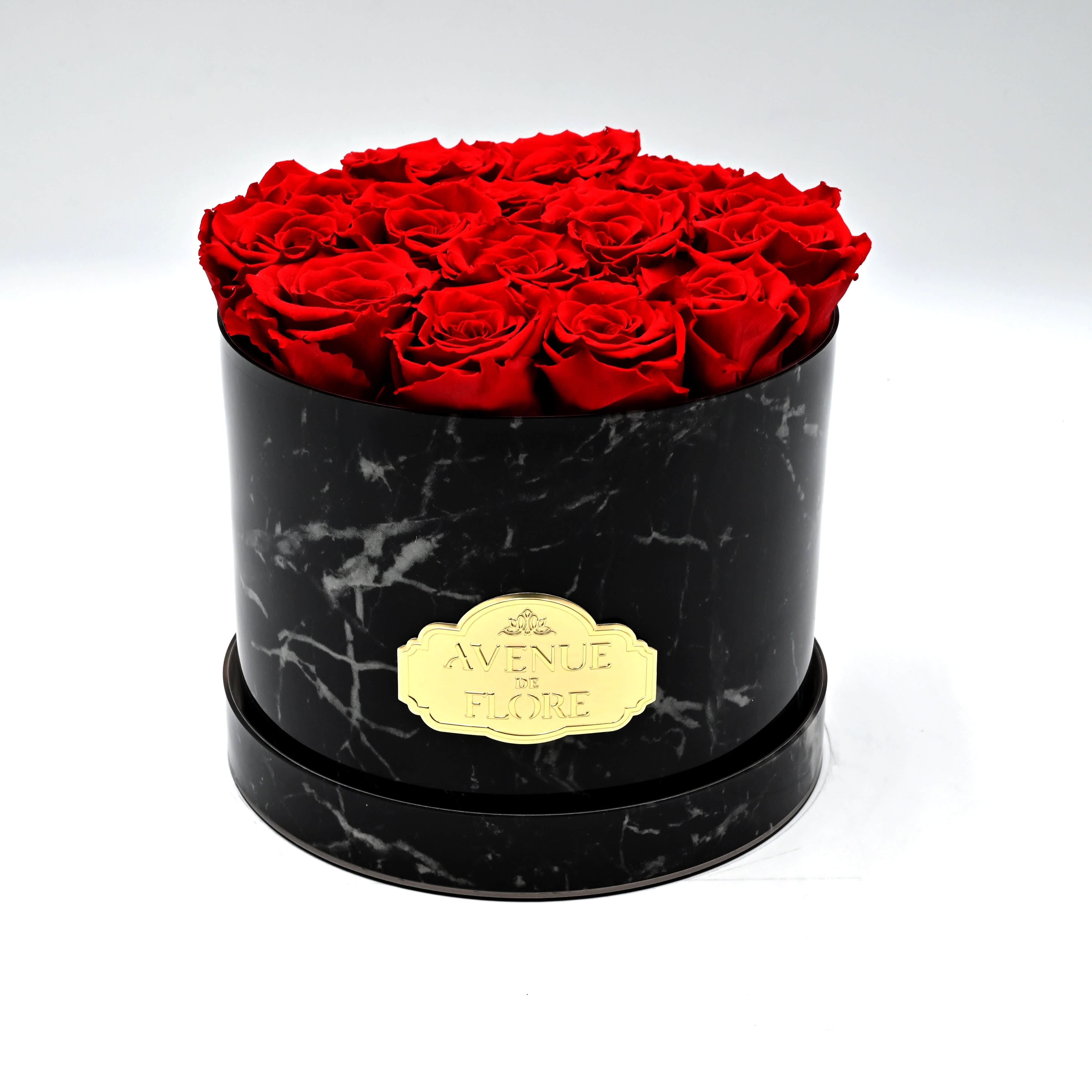 Black Marble Round - Red Forever Roses Black Marble Round - Red Forever Roses - PRESERVED ROSES. Discover timeless elegance with our exquisite Black Marble box adorned with 15 red roses. The sleek black marble exterior enhances any space, while the meticulously crafted red roses gracefully last for years in all their magnificence. Perfect as a unique gift or a statement piece for your home decor.