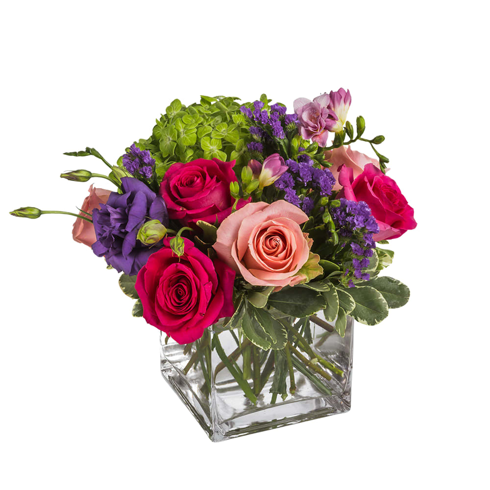 Big Island Bouquet - This flirty arrangement may include hot pink roses, pink roses, green hydrangea, lisianthus, purple statice and more, a compact gesture showcasing big style. A great gift for a birthday, get well, or just because.   