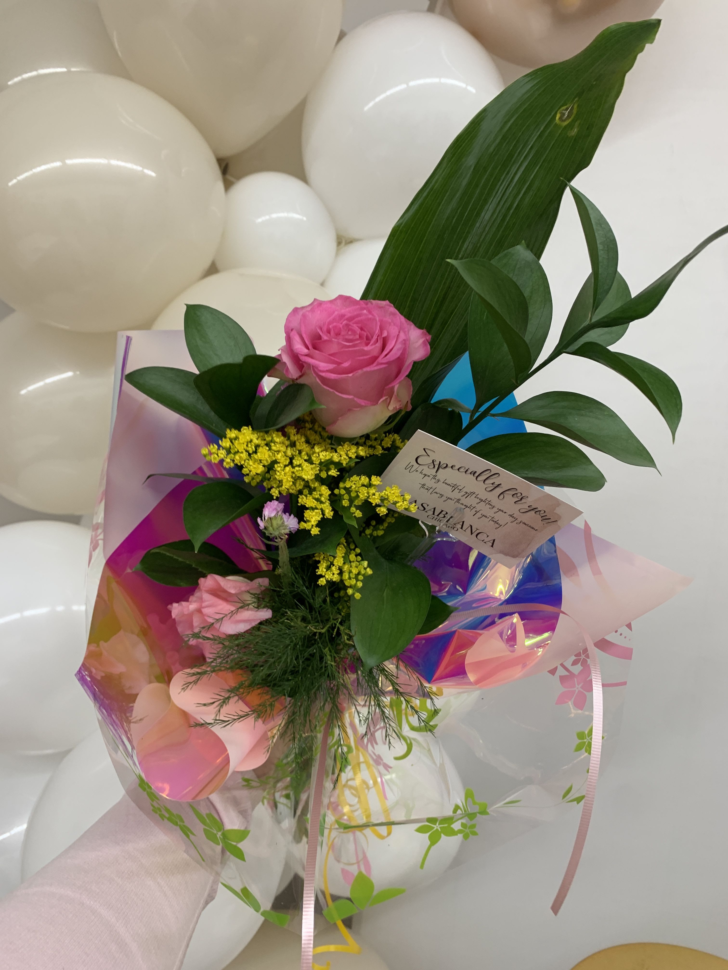 Hand Wrapped Bouquet Hand Wrapped Bouquet - Single rose with add on flowers wrapped in our super cute signature wrap.