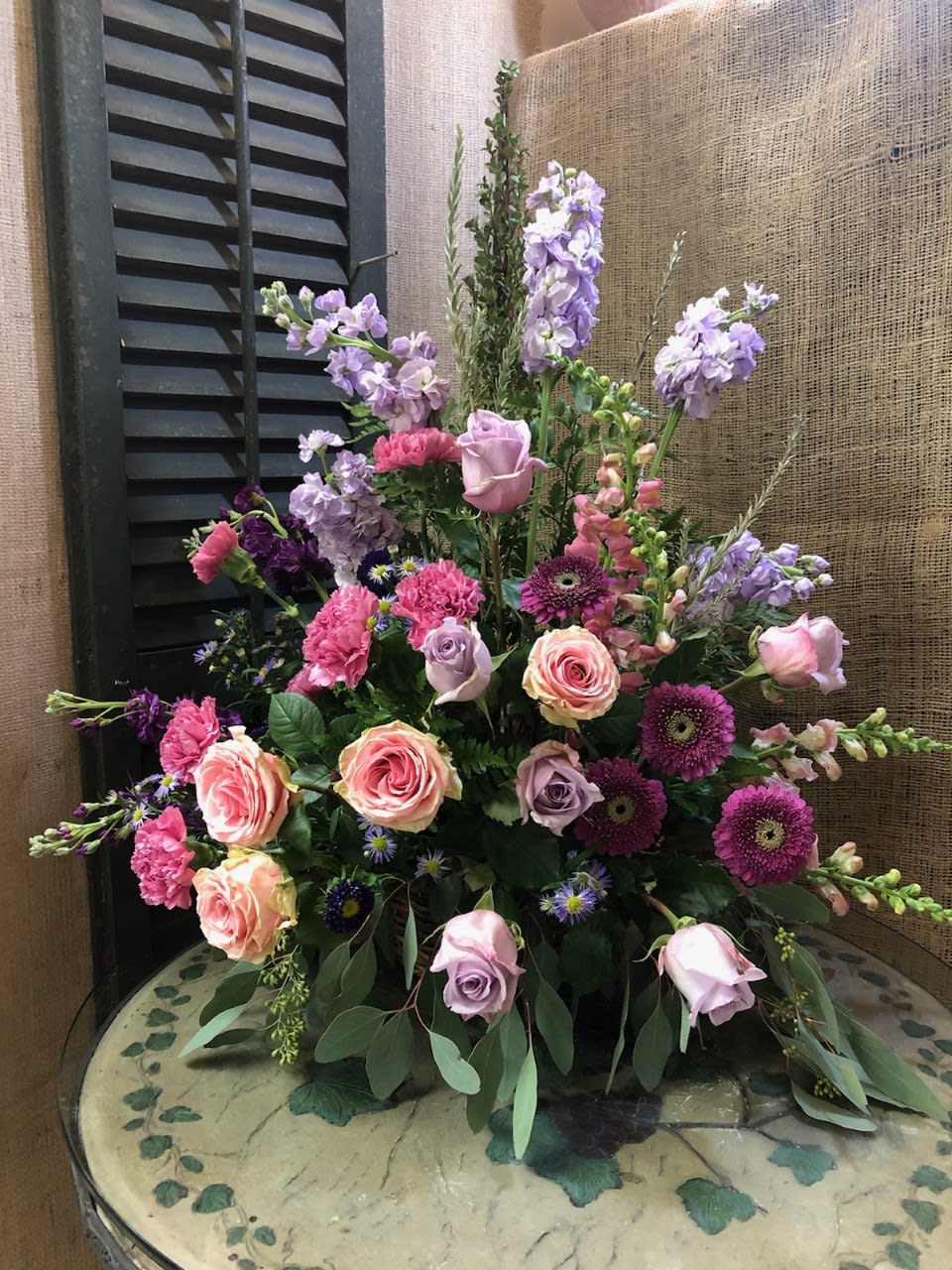 Purple Splendor - Beautiful one sided arrangement of purple and pink flowers