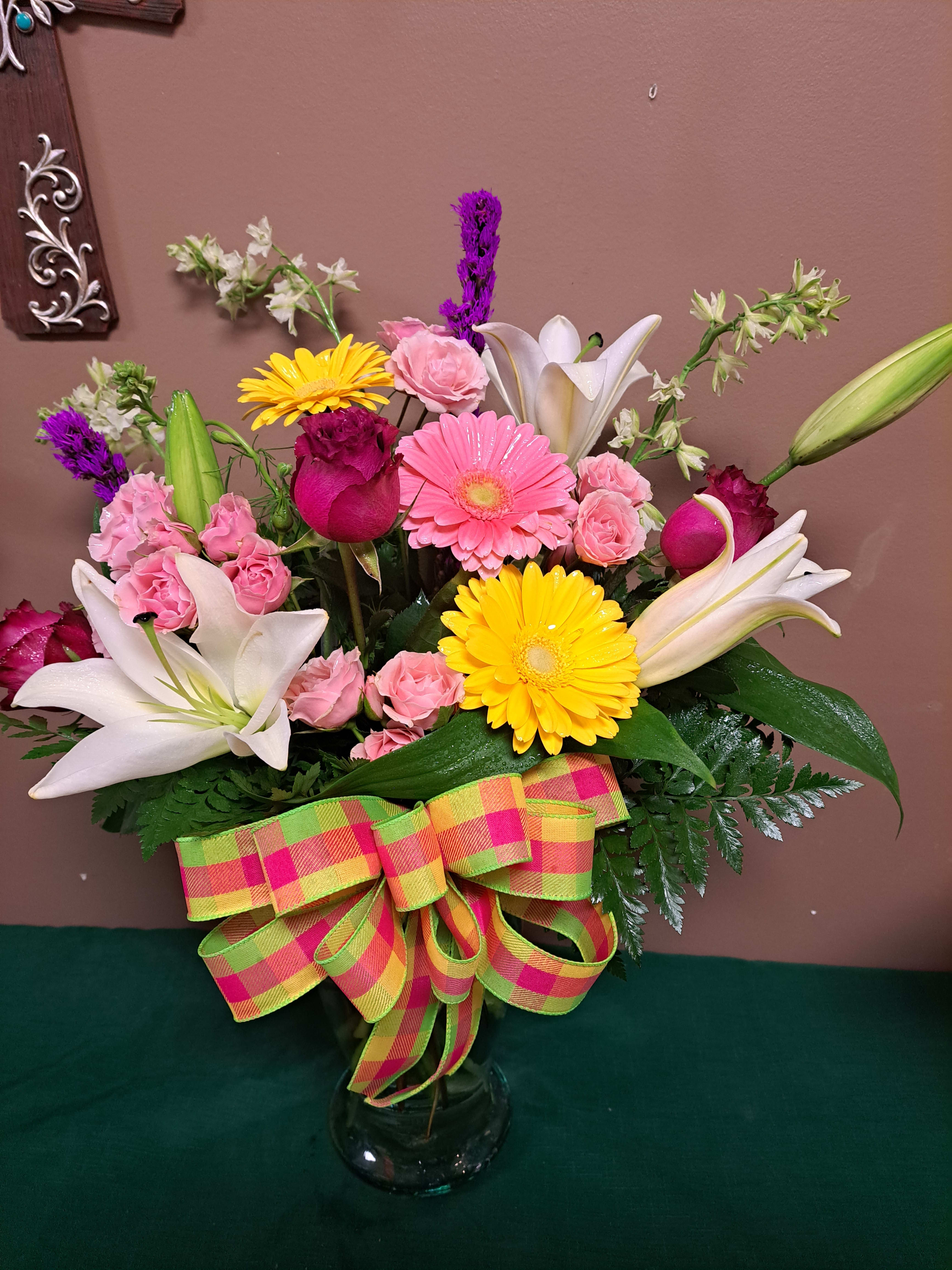 A Splash of Color A Splash of Color - A beautiful mixture of Bright Colors. This arrangement will make a statement for all occasions. It Contains Gerber daisies, roses, lilies, and other seasonal blooms.