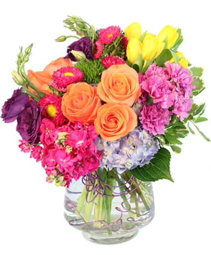 Vision of Beauty Floral Design  - Yellow tulips, orange roses, blue hydrangeas, oh my! Our Vision of Beauty arrangement is a rainbow of flowers great for anyone who loves color. This stunner is a great gift for birthdays, spring, or the special ladies in your life.    