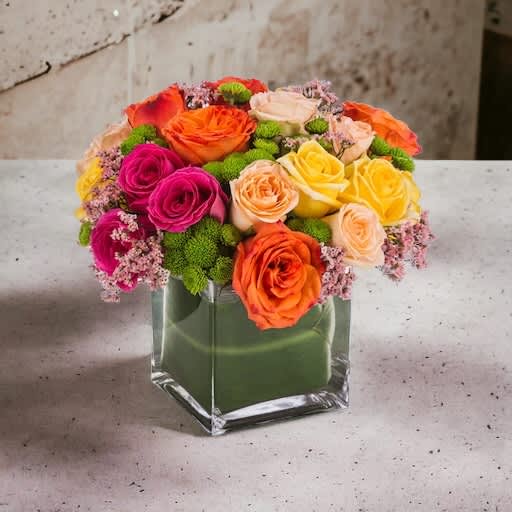 Kaleidoscope - A full-color explosion, Kaleidoscope is a beautiful gift for anybody! A glass cube is filled with colorful and long lasting spray roses in gorgeous colors!! We will choose the perfect color combo for you and make sure arrangement is absolutely perfect. Colors may vary due to availability, but we promise a riot of fragrant color.   Approximate Dimensions: 14&quot;D x 14&quot;H