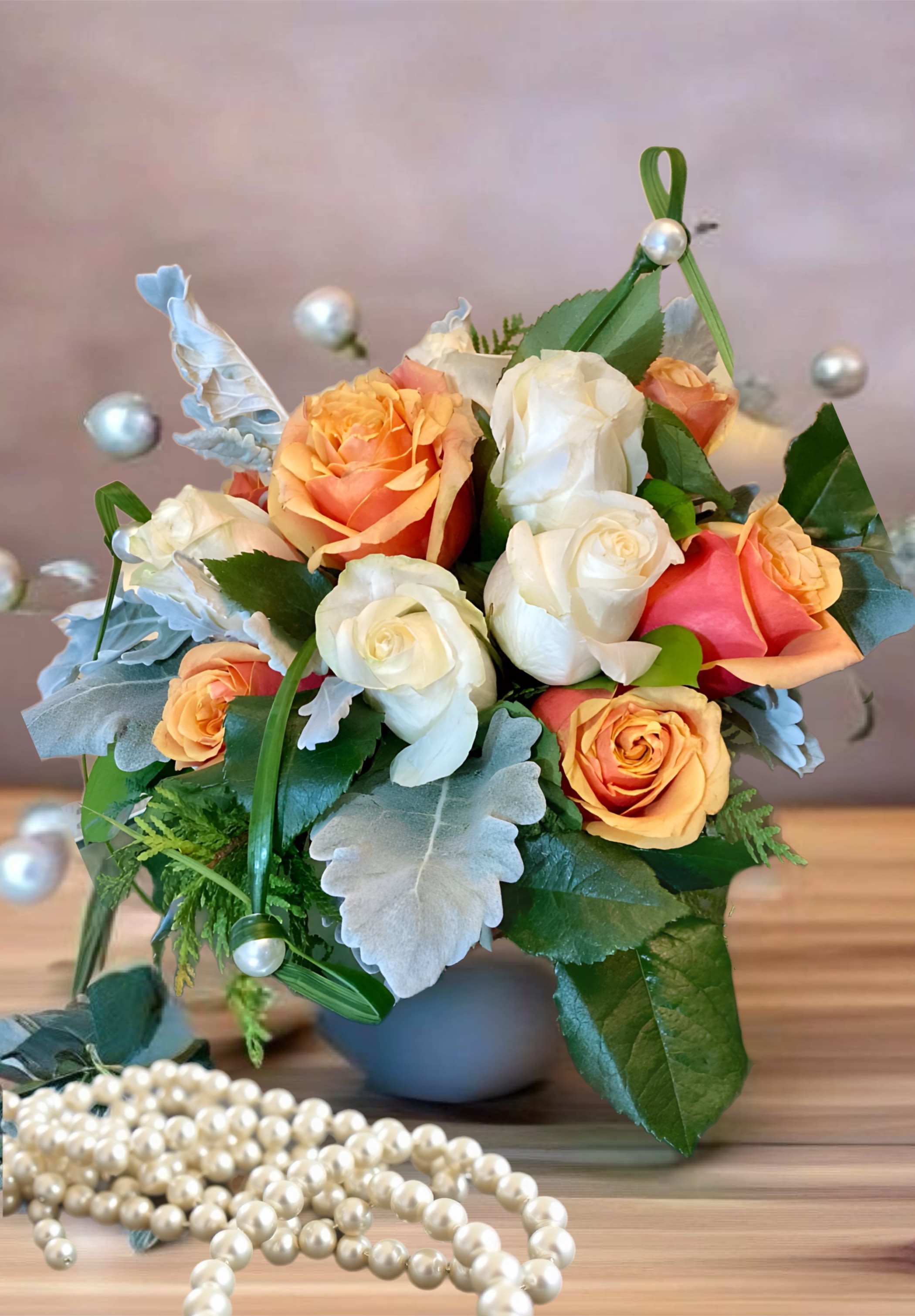 Fall in Spring. A Floral Archist™ Original. - For ‘All year round Autumn lover’, this beautiful bouquet of white and orange roses, will be the perfect gift to celebrate that Fall is not that far away…   Perfect for that special guy, men love flowers too!  NOTE: Our flowers and greens are a gift from nature. It’s shade and depth might vary, design, aesthetic and value remains the same. In support of our efforts to aide in the preservation of our planet, PJf uses Fair Trade flowers, Plants, Upcycled and Recycled containers.