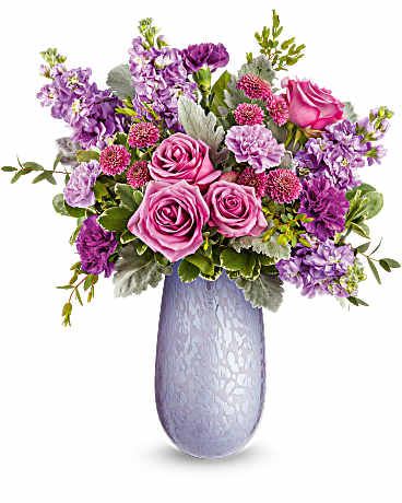 Vivi Bouquet - Capture Mom's heart with the Vivi vase, crafted from hand-blown art glass with an iridescent finish, radiating elegance and charm. Paired with a stunning bouquet of lavender blooms, it's a delightful Mother's Day surprise she'll cherish.