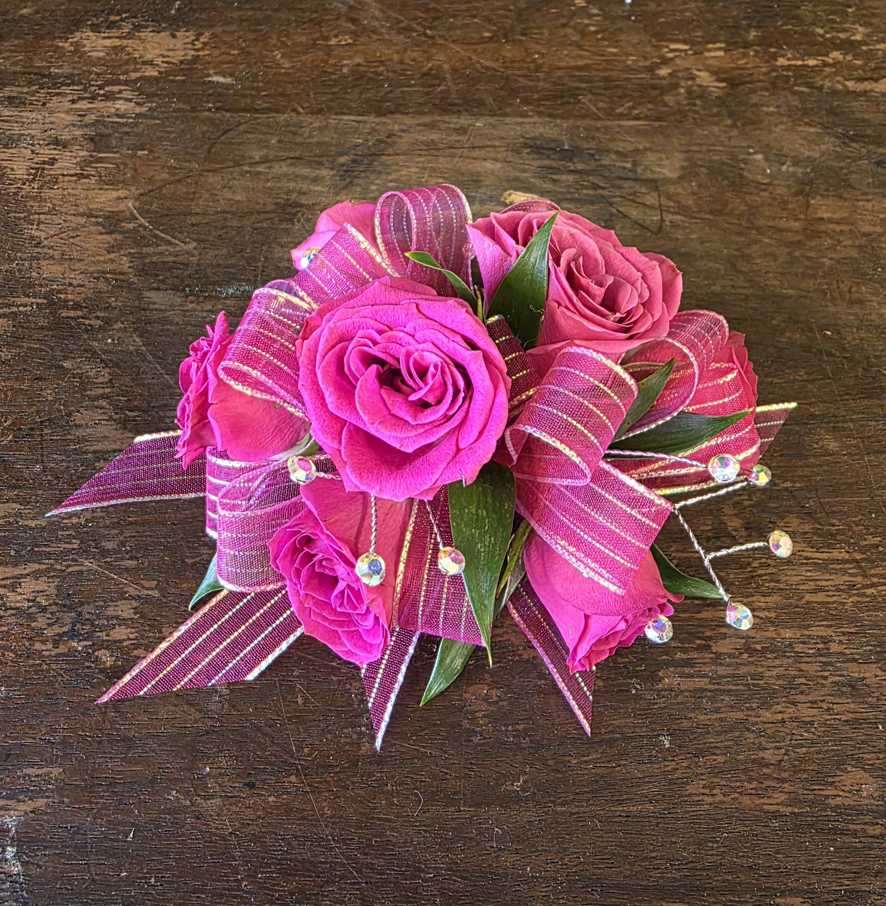 Hot Pink Wrist Corsage - Wrist Corsage Featuring Hot Pink Spray Roses, Hot Pink Ribbon, Iridescent Rhinestones And Greenery.