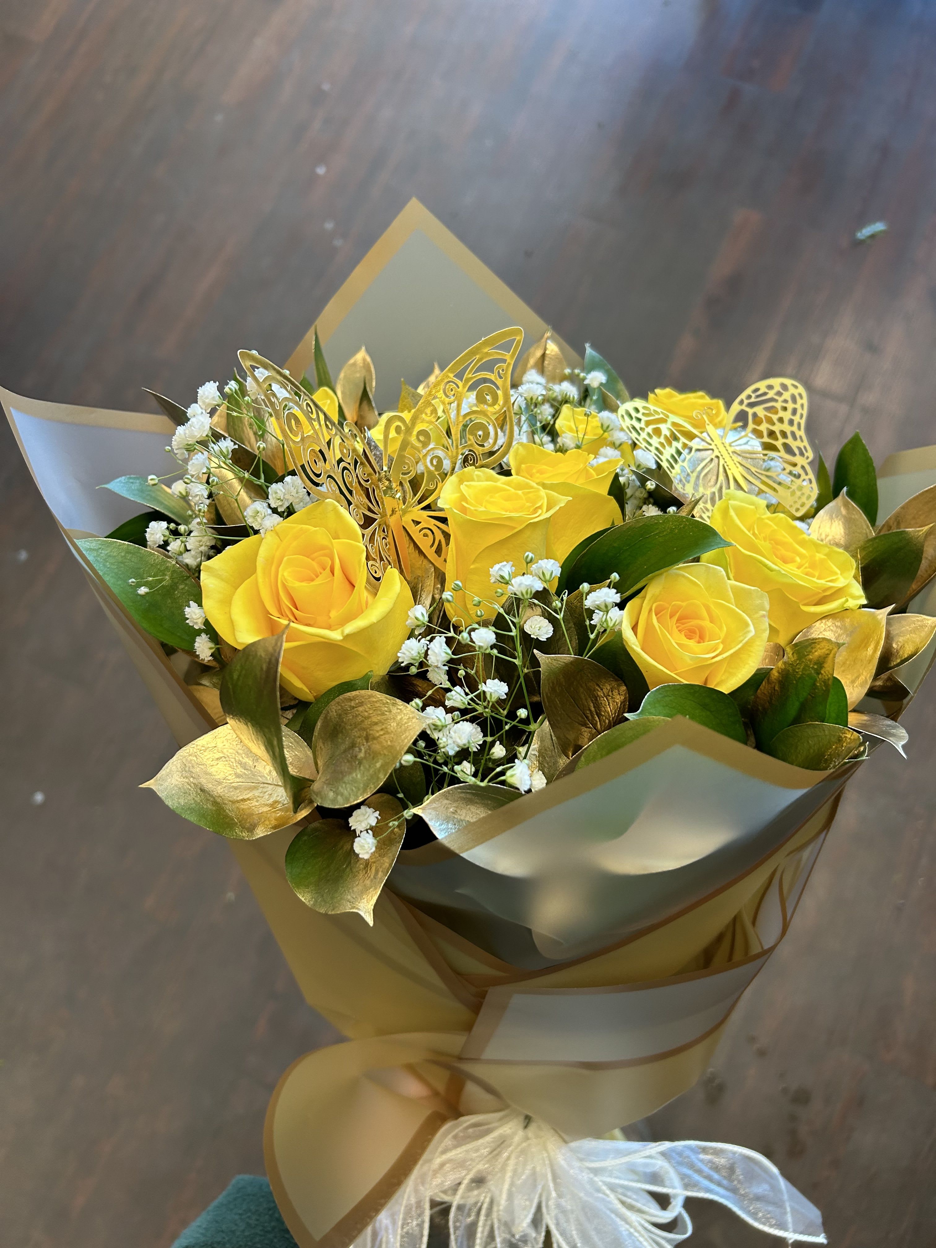 12 YELLOW ROSES IN  A WRAP (NO VASE) - 12 YELLOW ROSES WITH GOLD RUSCUS AND BABY BREATH ALL WRAPPED IN COLOR KOREAN PAPER. STANDARD INCLUDES 12 ROSES DELUXE INCLUDES 18 ROSES PREMIUM INCLUDES 24 ROSES