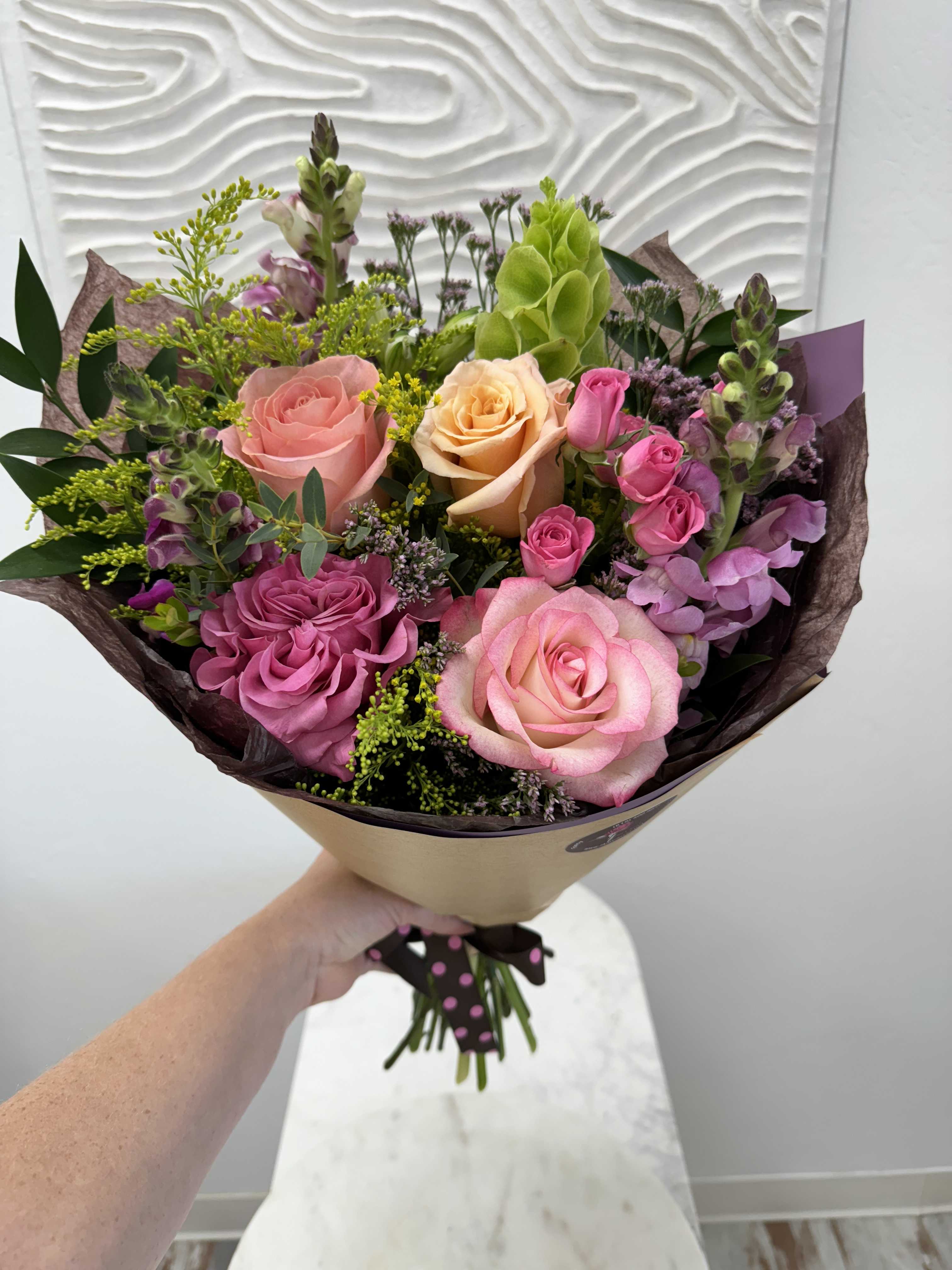Wrapped Bouquet 100 - Wrapped Bouquet 100 is a versatile bouquet with freshest blooms of the day. 