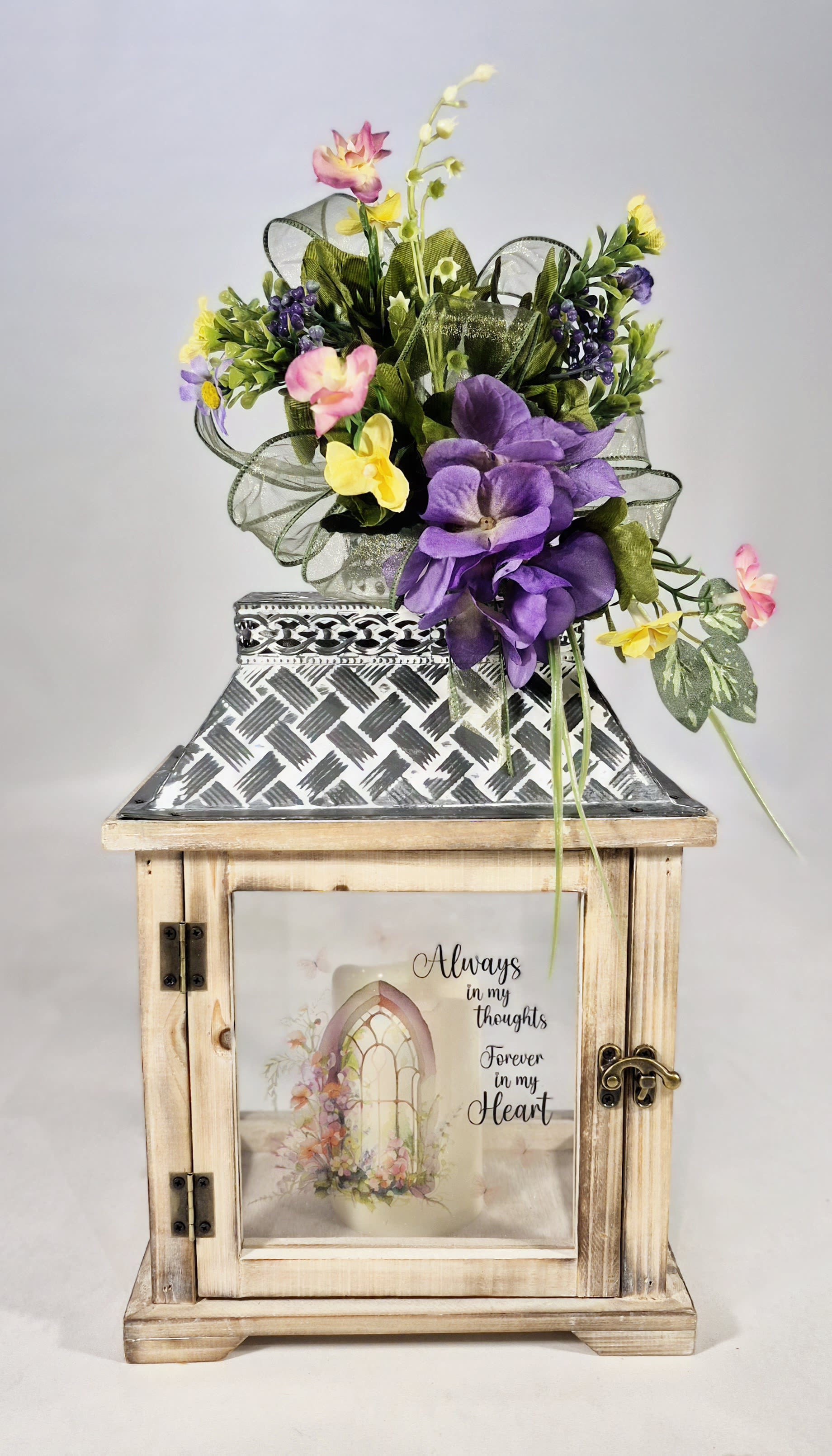 Always in My Thoughts Lighted Sympathy Lantern - Always in my thoughts Forever in my heart lighted sympathy lantern. Light blonde wood lantern with silk floral arrangement and flameless candle.  22&quot; Tall 24&quot; Wide 