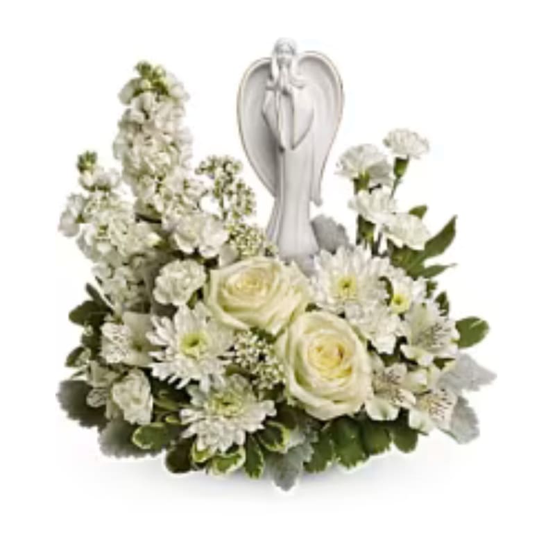 Teleflora's Guiding Light Bouquet Teleflora's Guiding Light Bouquet - As serene as gently falling snow, this pure white arrangement of roses, astroemeria and stock is a heartfelt symbol of peace and beauty. Its graceful angel keepsake sculpture will remain a guiding light to your loved ones for years to come. White roses, white alstroemeria, white stock, white miniature carnations, white cushion spray chrysanthemums are arranged with white waxflower, dusty miller and variegated pittosporum. Delivered with Teleflora's Angel of Grace keepsake. Orientation: One-Sided  SUBSTITUTION POLICY - Always deliver the freshest flowers! Please note the bouquet pictured reflects our original design.  If the exact flowers or container in this arrangement are not available, our local florists will create a beautiful bouquet with the freshest available flowers.