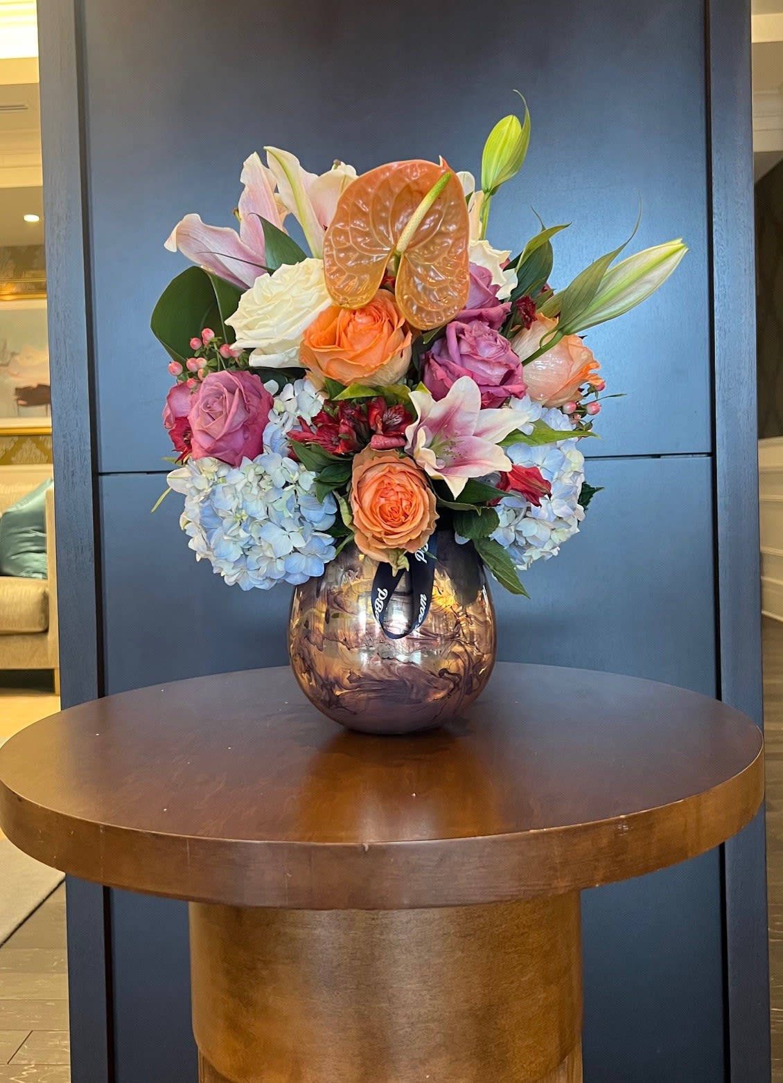 Summer Garden - A fresh mix of pinks and oranges that combine roses and seasonal stems. 